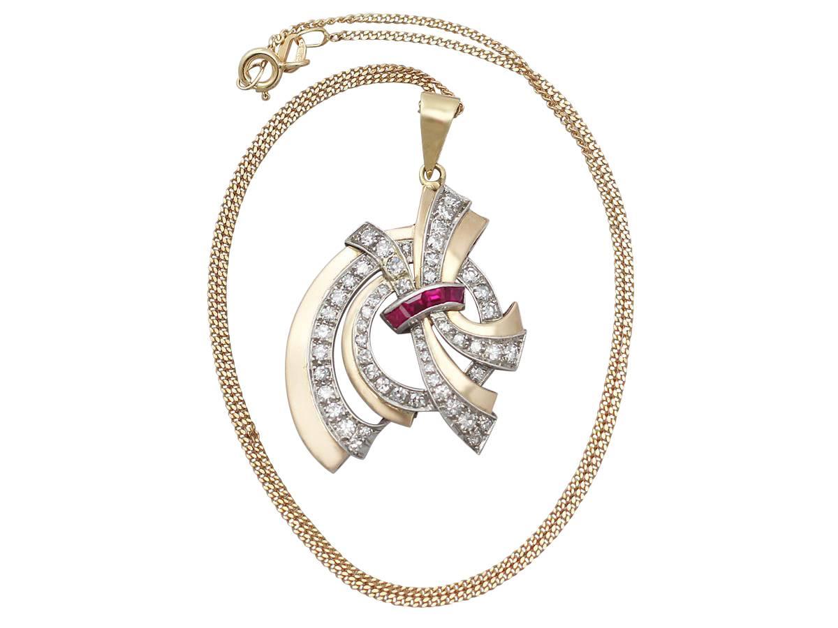 A fine and impressive 18 karat yellow gold antique pendant in the Art Deco style, with 1.16 carat diamonds and synthetic rubies; part of our antique jewelry and estate jewelry collections

This impressive antique pendant has been crafted in 18k