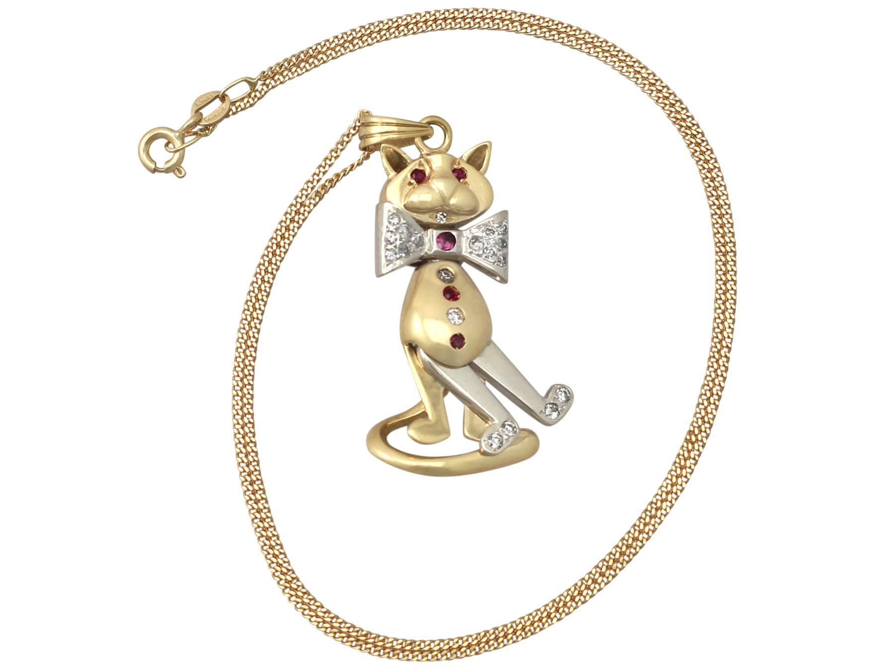 A fine and impressive vintage 0.39 carat diamond and 0.12 carat natural ruby, 18 karat yellow gold and 18 karat white gold cat pendant; part of our diverse vintage jewelry range

This fine and impressive vintage cat pendant has been crafted in 18k