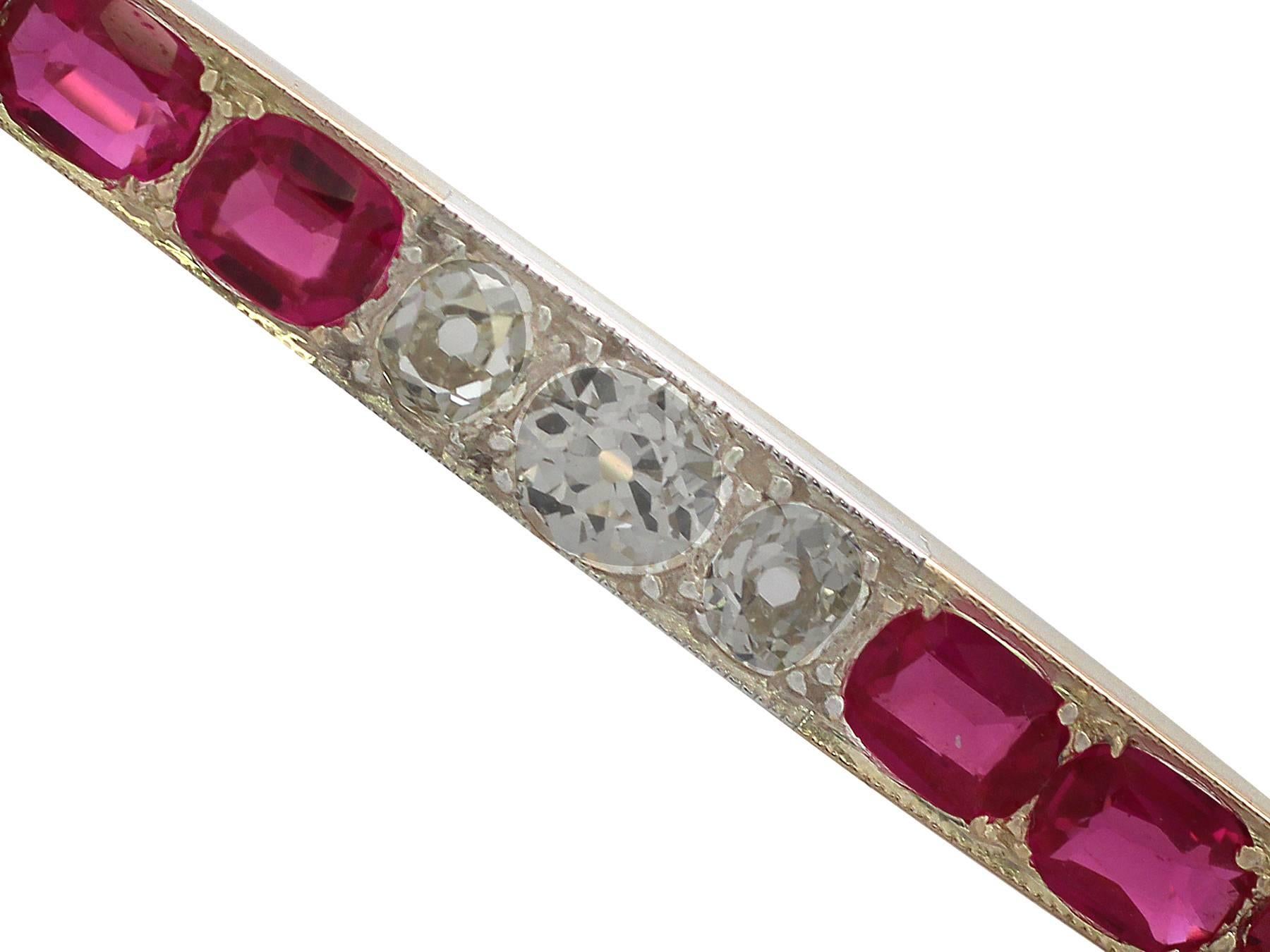 A fine and impressive antique 1.76 carat diamond and synthetic ruby, 18 karat yellow gold, silver set bar brooch; part of our diverse antique jewelry collection

This fine and impressive synthetic ruby and diamond bar brooch has been crafted in 18k