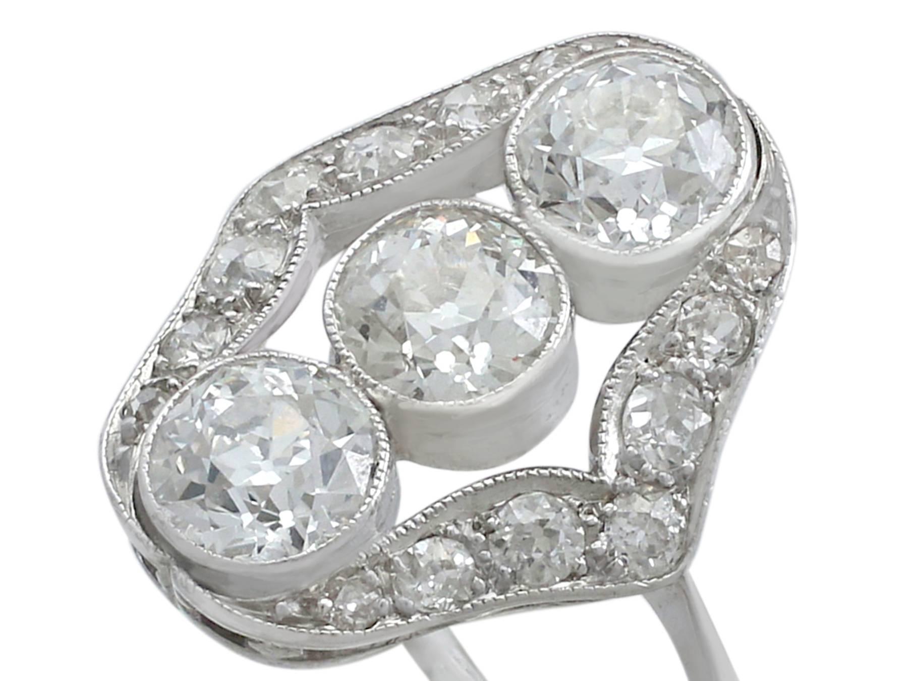 Women's 1910s Antique 2.44 Carat Diamond Platinum Three-Stone Ring