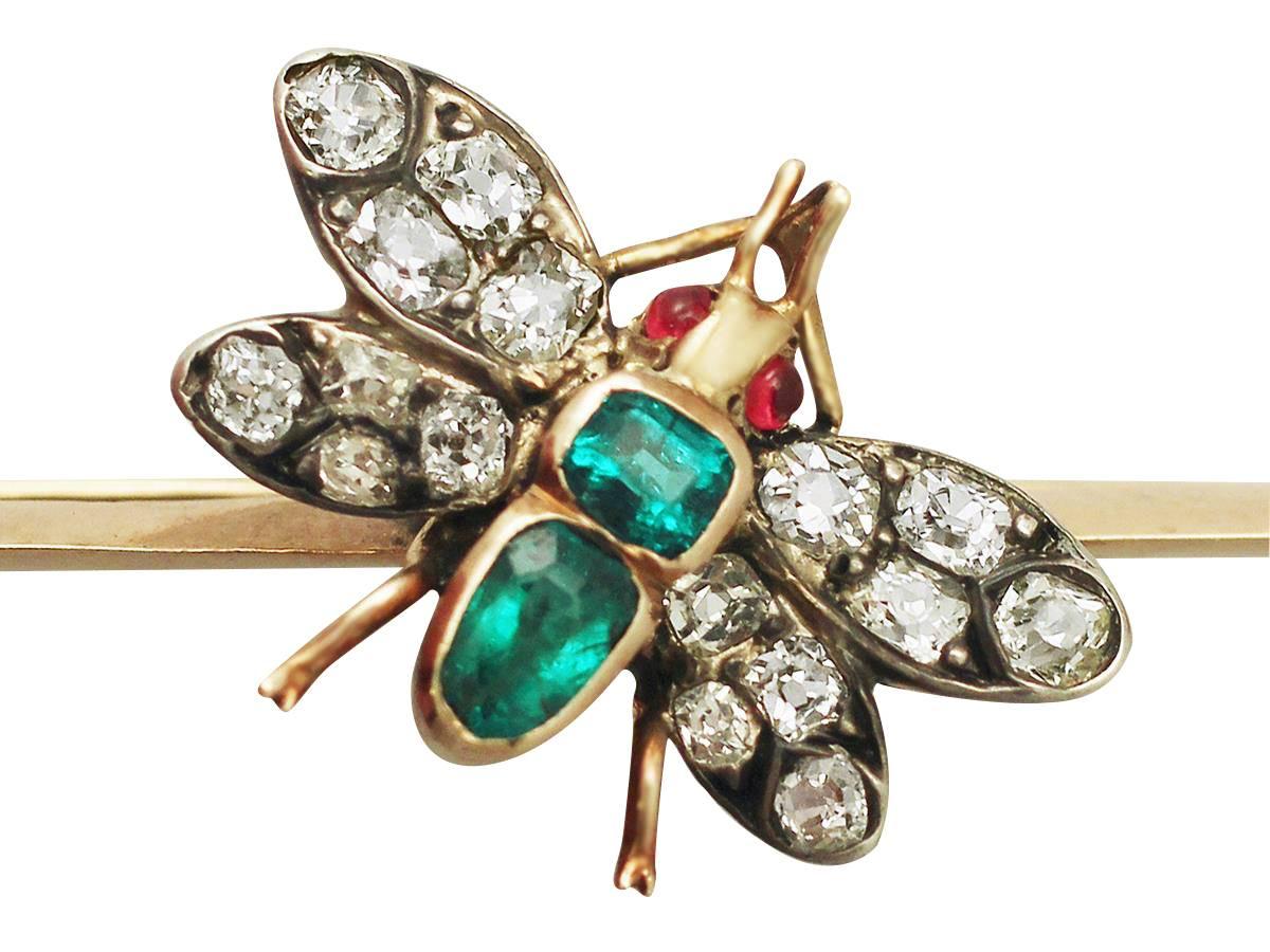 A fine and impressive antique Victorian 1.38 carat diamond, 0.42 carat emerald and 0.06 carat ruby, 9 karat yellow gold, silver set brooch in the form of an insect; part of our antique jewelry and estate jewelry collections

This impressive antique