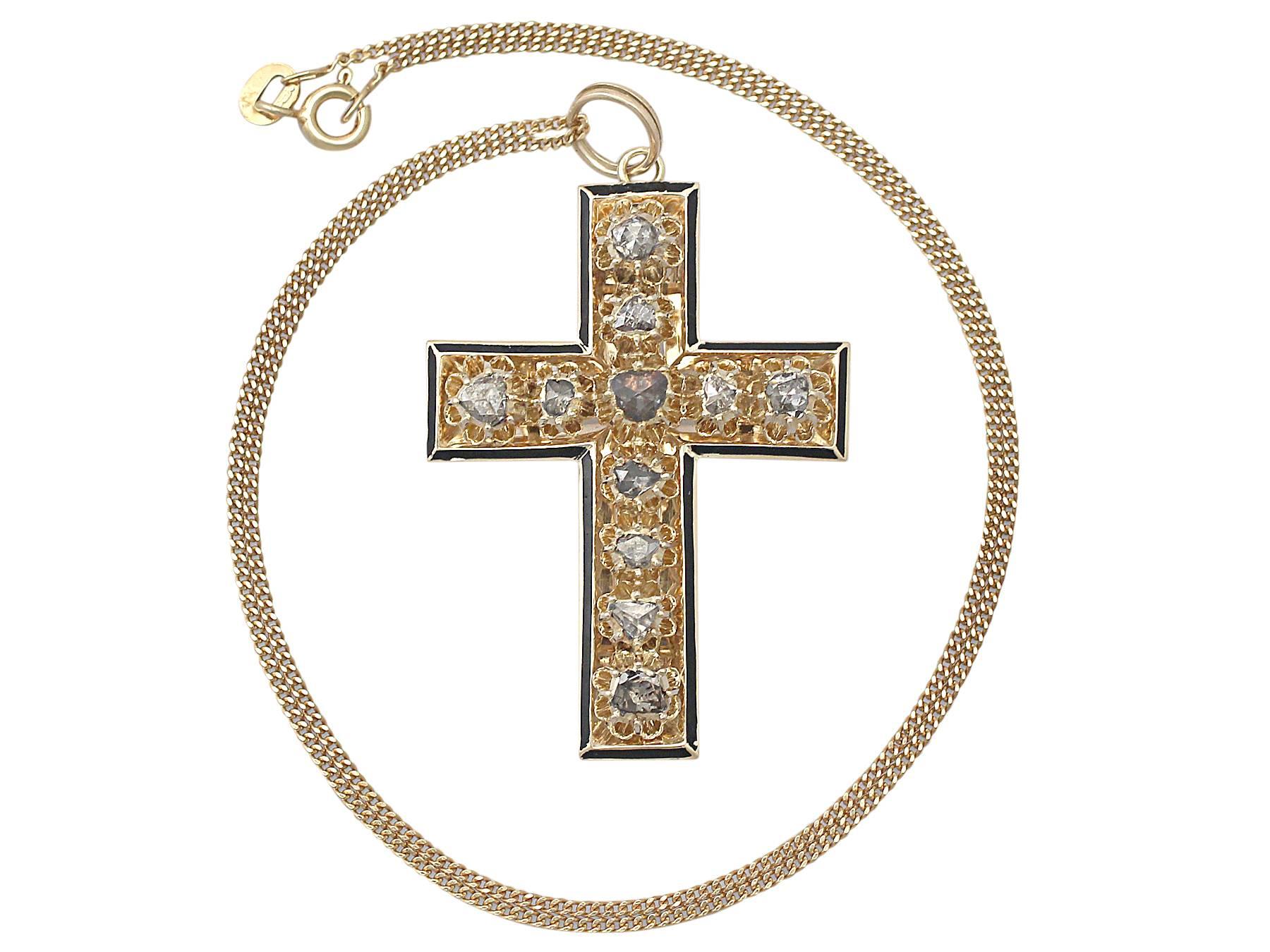 A stunning, fine and impressive antique Victorian 1.42 carat diamond, black enamel and 14 karat yellow gold cross pendant; part of our diverse antique jewelry and estate jewelry collections

This stunning, fine and impressive Victorian cross pendant