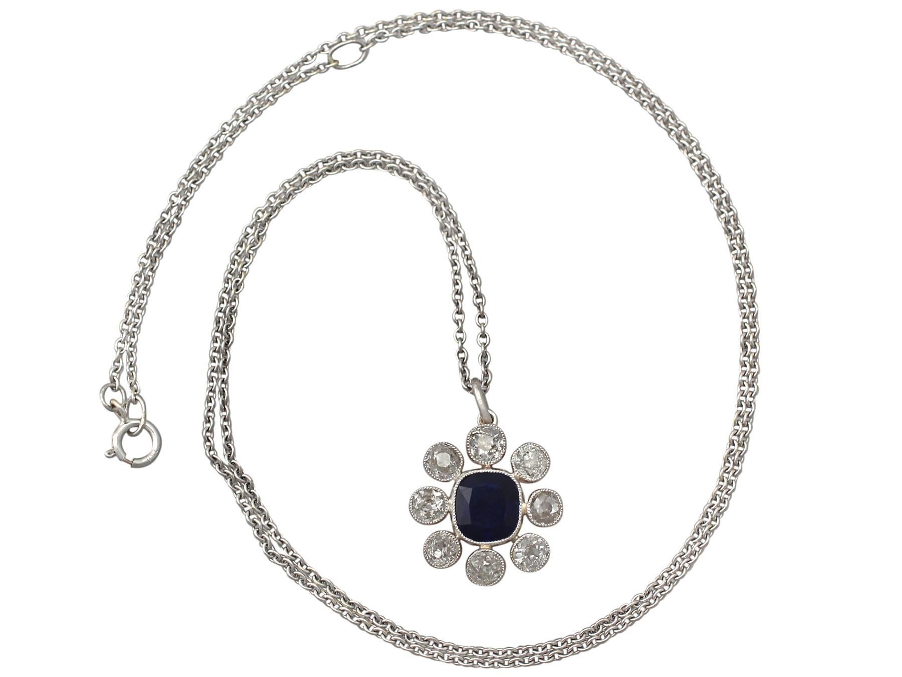 A stunning, fine and impressive antique 0.95 carat natural blue sapphire and 0.90 carat diamond, 15 karat yellow gold and platinum set pendant; part of our antique jewelry and estate jewelry collections

This stunning, fine and impressive sapphire
