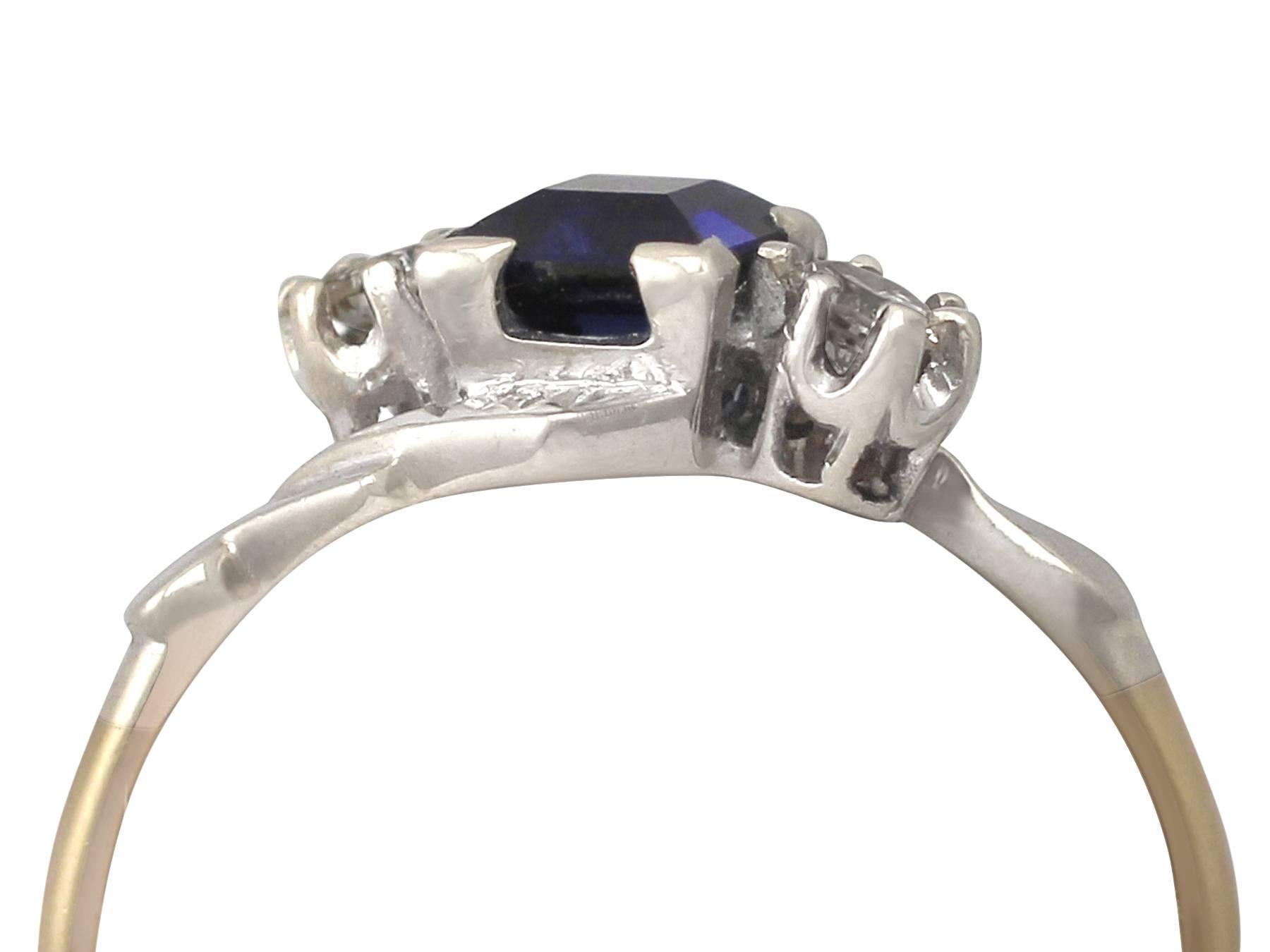 A fine and impressive 0.55 carat natural blue sapphire and 0.18 carat diamond, 18 karat yellow gold and 18 karat white gold set twist ring; part of our vintage jewelry and estate jewelry collections.

This fine and impressive vintage 1950's ring