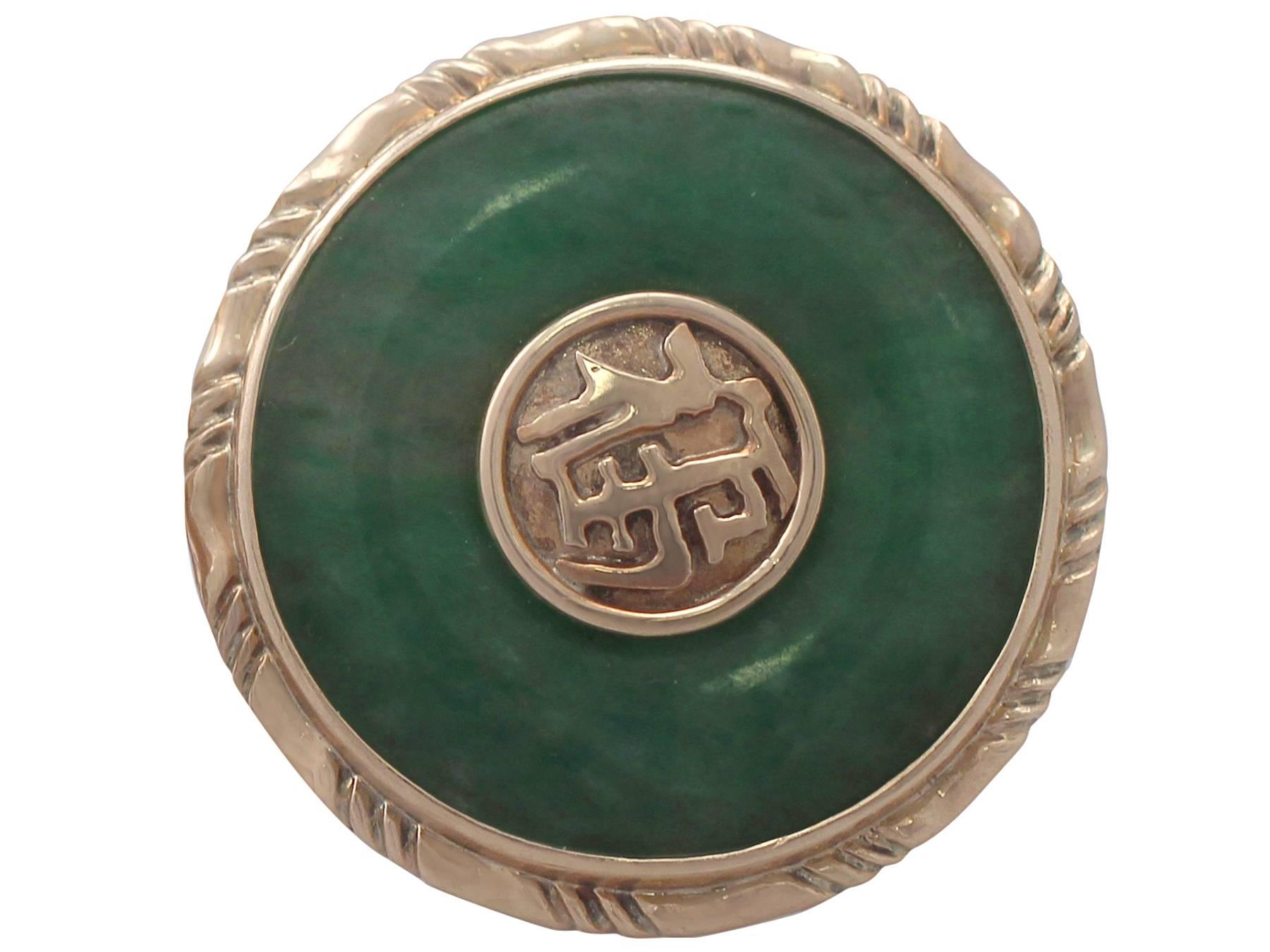 A fine and impressive pair of vintage jade and 14 karat yellow gold cufflinks; part of our men's jewelry and estate jewelry collections

These fine and impressive vintage jade (jadeite*) cufflinks have been crafted in 14k yellow gold.

The