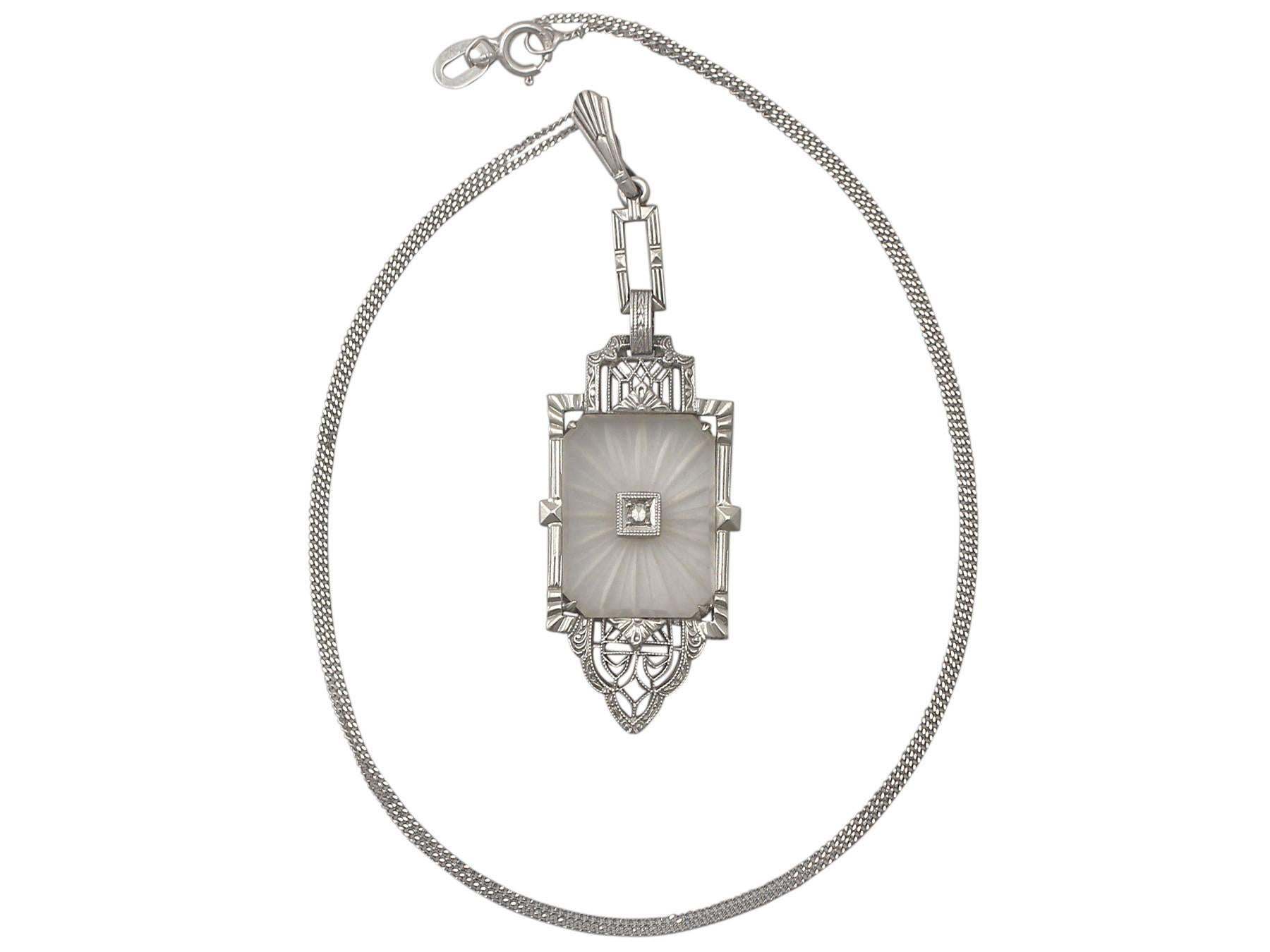 A fine and unusual antique 0.02 carat diamond and crystal, 14 karat white gold Art Deco pendant; part of our diverse antique jewelry and estate jewelry collections

This fine and impressive antique pendant has been crafted in 14k white gold.

The