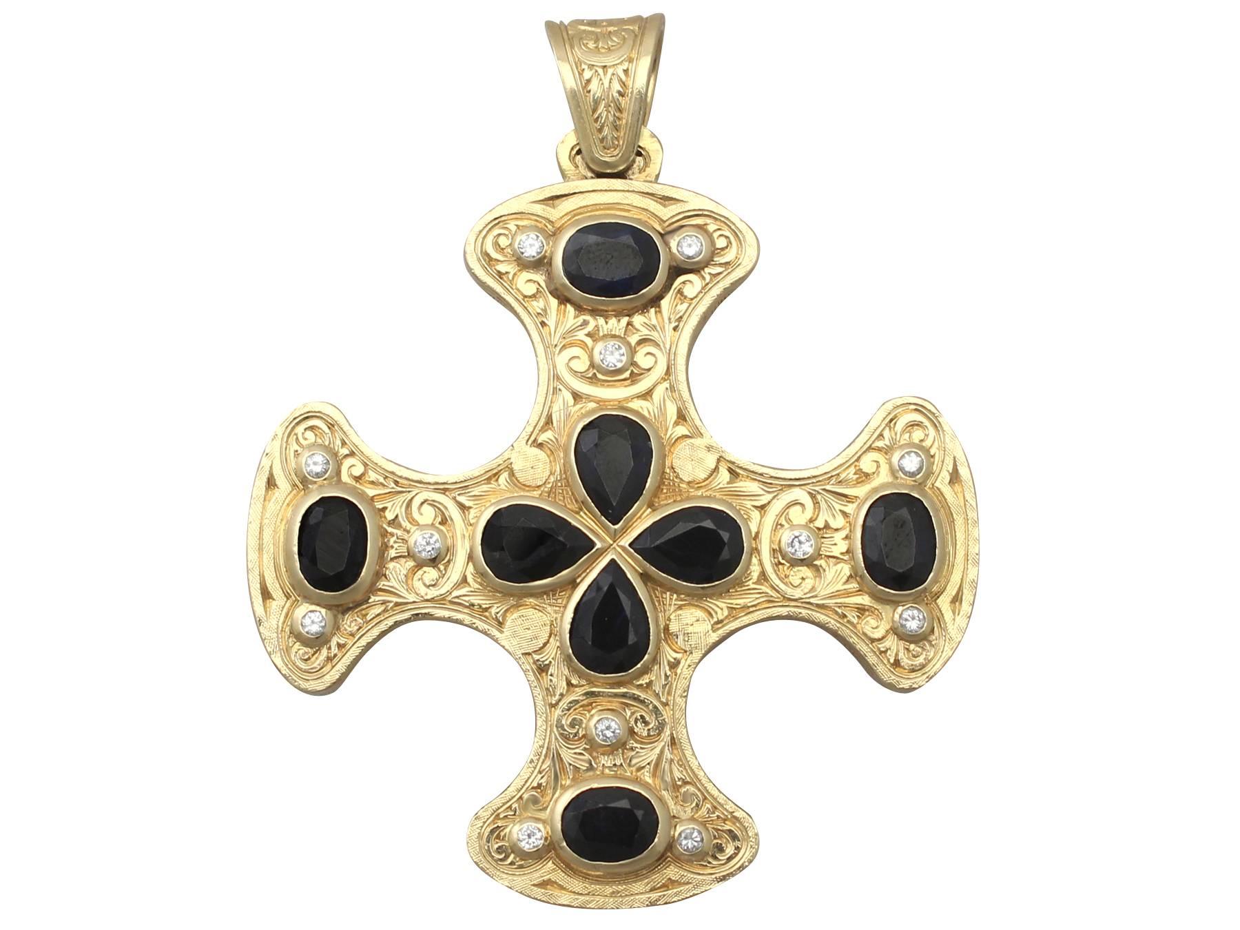 A large and impressive vintage gemstone cross pendant incorporating 12.80 carat natural sapphires, 7.85 carat natural rubies and 1.00 carat diamonds, in 18 karat yellow gold; part of our diverse vintage jewelry and estate jewelry collections

This