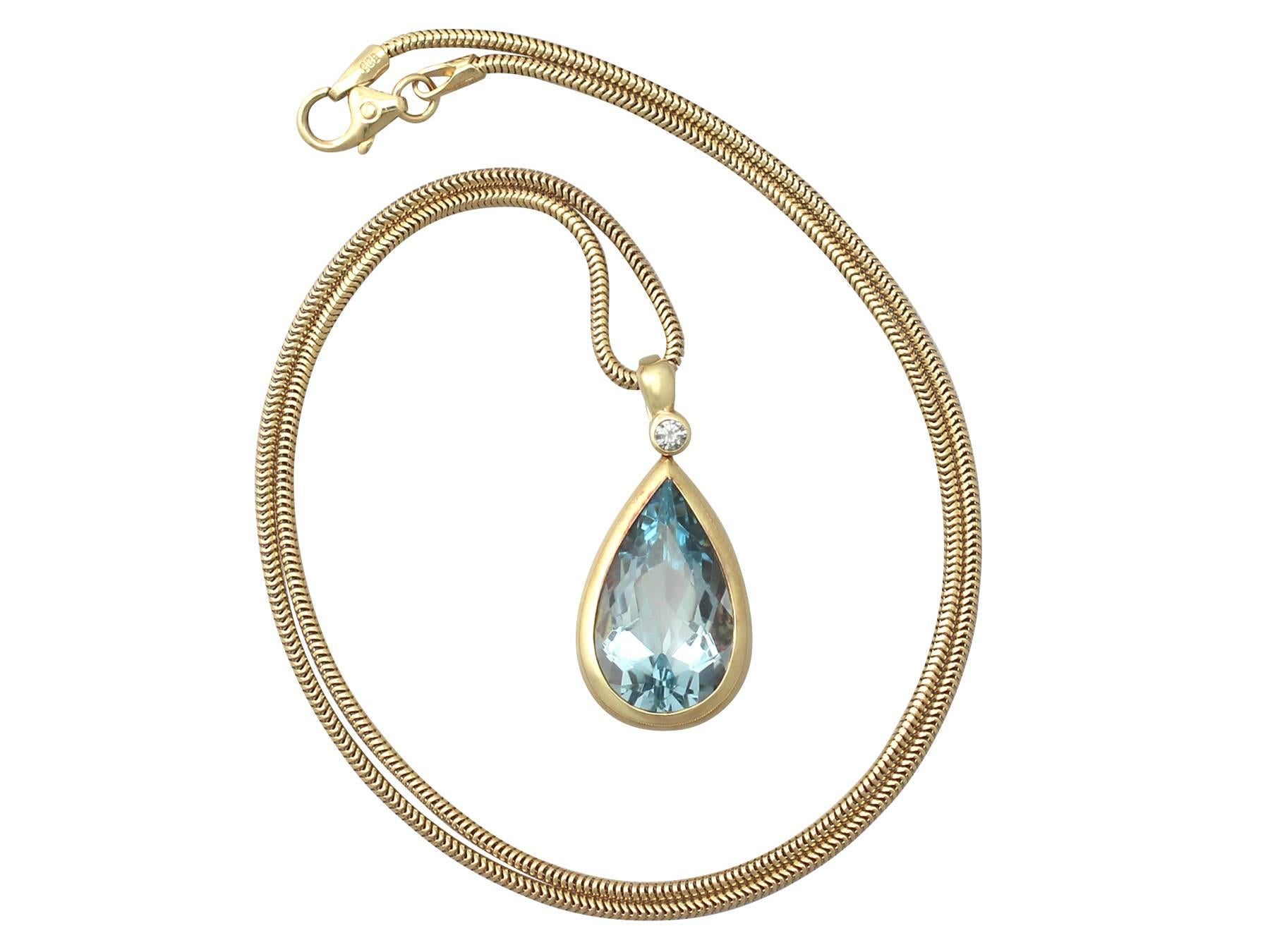 A fine and impressive 6.04 carat aquamarine and 0.04 carat diamond, 14 karat yellow gold pendant; part of our diverse jewelry and estate jewelry collections

This fine and impressive aquamarine and diamond pendant has been crafted in 14k yellow