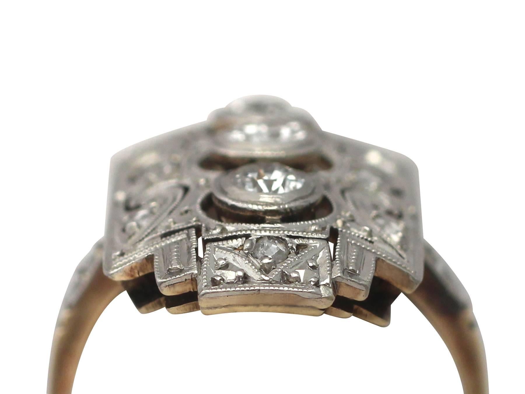A fine and impressive antique Art Deco 0.88 carat diamond and 14 karat yellow gold, 14 karat white gold set dress ring; part of our diverse antique jewelry collections

This fine and impressive antique Art Deco diamond ring has been crafted in 14k