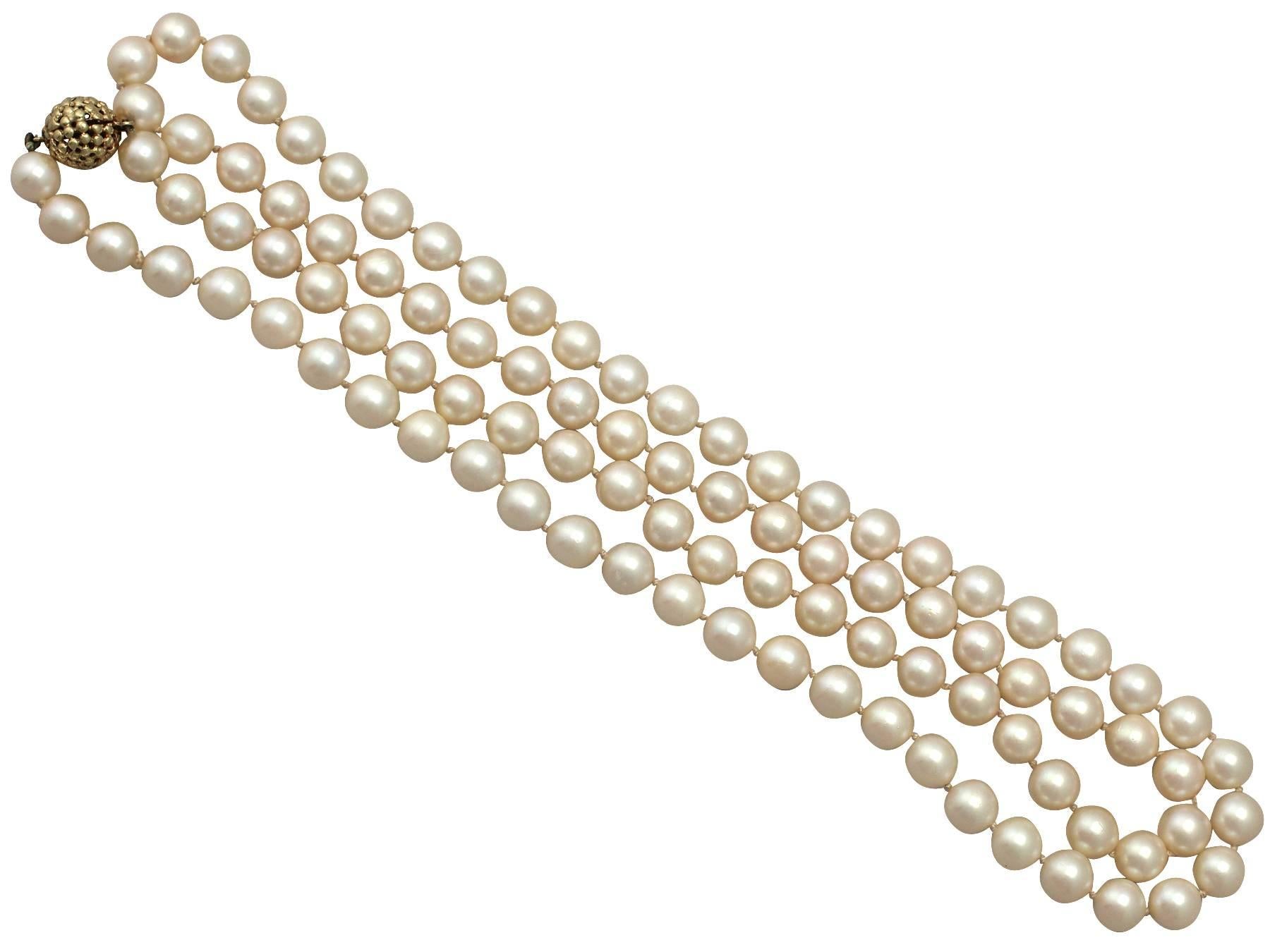 A fine and impressive single strand cultured Japanese Akoya pearl necklace with a feature 14 karat yellow gold clasp; part of our diverse necklace collection

This fine and impressive vintage pearl necklace consists of ninety-six individually