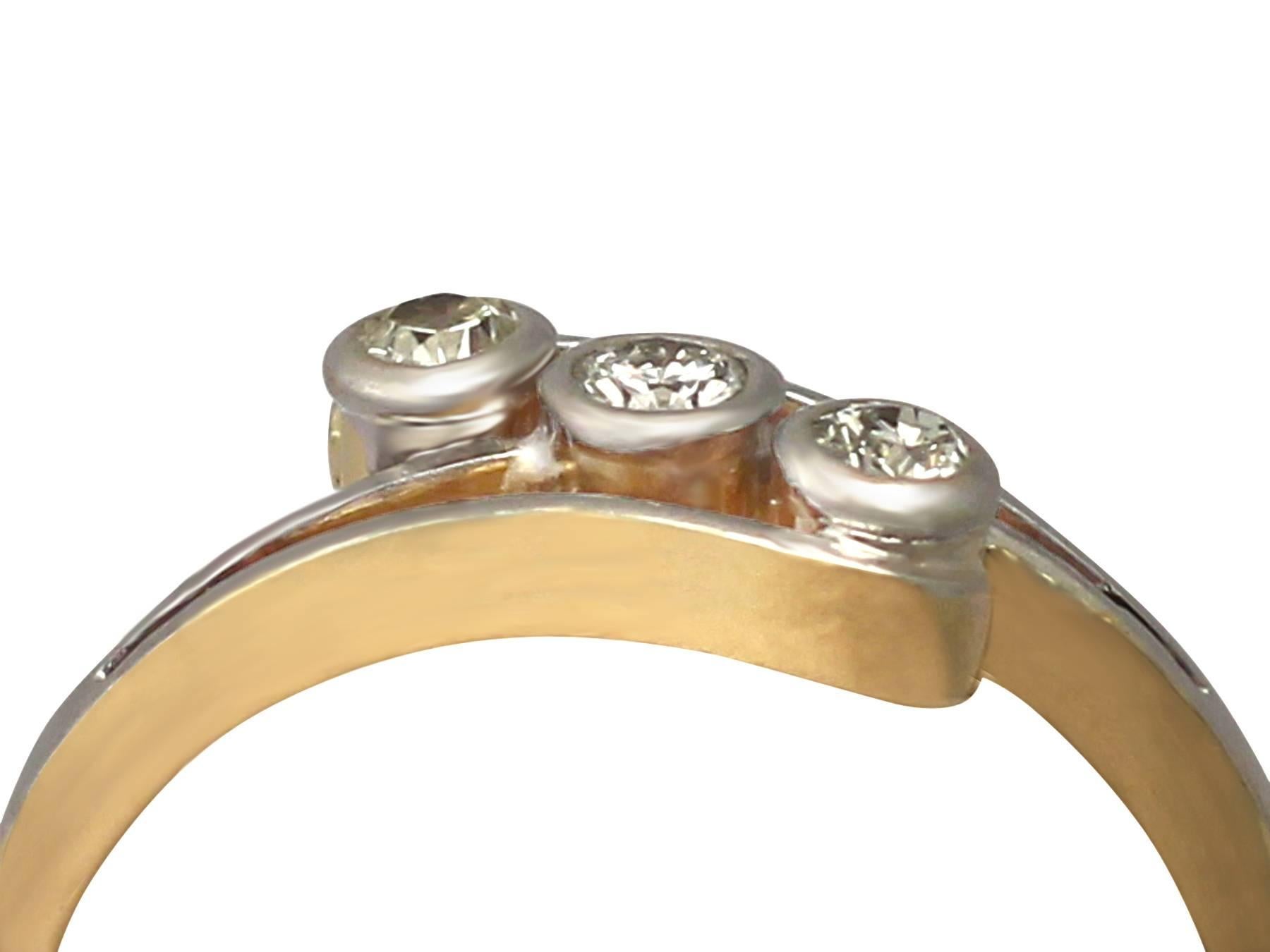 A fine vintage 0.18ct diamond and 18 karat yellow gold, platinum set trilogy twist / dress ring; part of our diverse vintage jewelry and estate jewelry collections

This fine diamond twist trilogy ring has been crafted in 18k yellow gold with a
