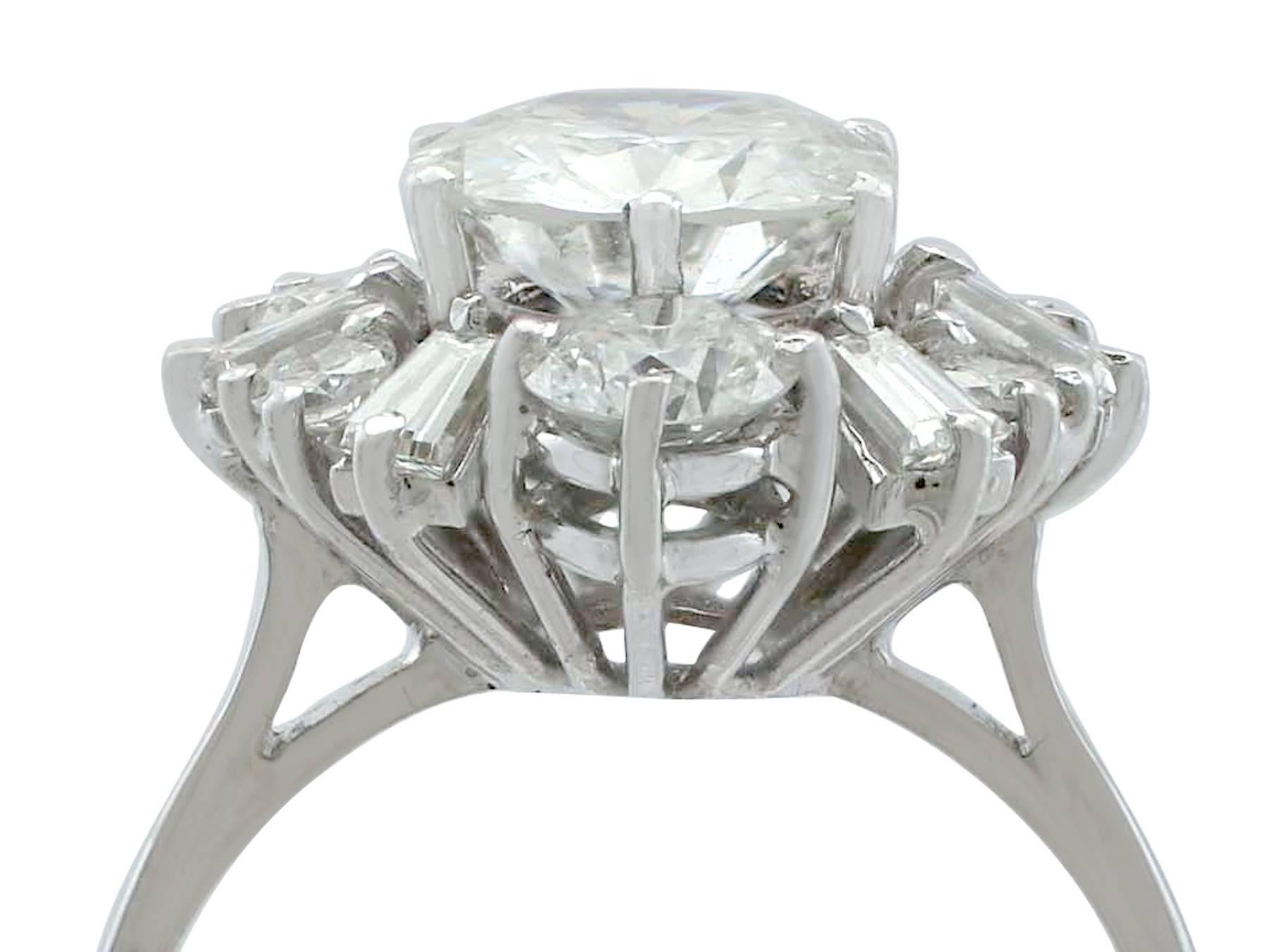 A stunning, fine and impressive vintage 3.17 carat diamond (total) and 18 karat white gold cluster ring in the Art Deco style; part of our diverse vintage jewelry collections.

This stunning, fine and impressive diamond cluster ring has been crafted