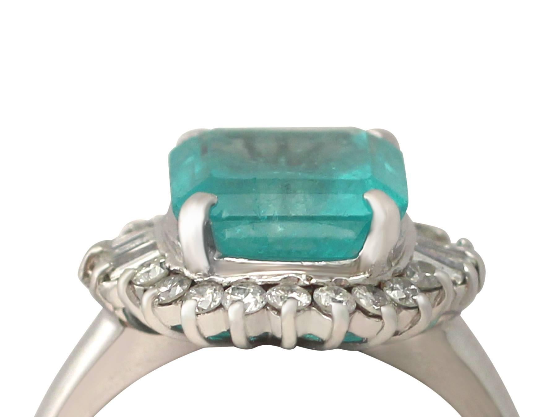 A fine and impressive 3.65 carat emerald and 0.25 carat diamond, platinum dress / cluster ring; part of our diverse vintage jewellery and estate jewelry collections

This fine and impressive emerald and diamond ring has been crafted in