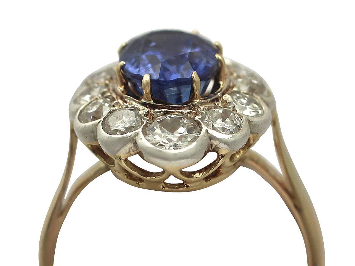 A stunning, fine and impressive 3.76 carat natural blue sapphire and 1.50 carat diamond, 18 karat yellow gold, silver set, dress ring; part of our antique jewelry and estate jewelry collections.

This impressive antique sapphire dress ring has been