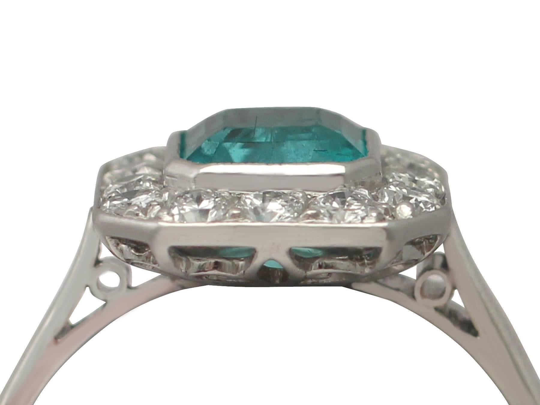 A fine and impressive vintage 0.90 carat emerald and 0.42 carat diamond, platinum cluster / dress ring; part of our diverse vintage jewellery and estate jewelry collections

This fine and impressive vintage emerald cluster ring has been crafted in