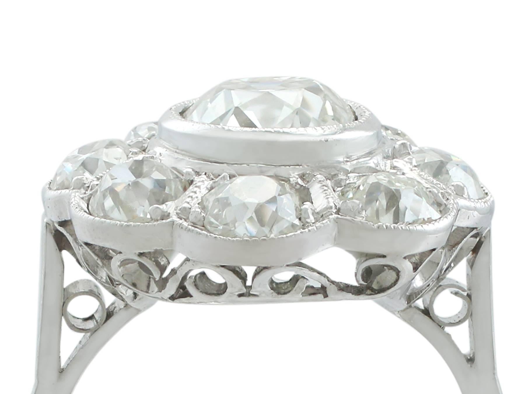 A stunning, fine and impressive French 3.94 carat diamond (circa 1900) and platinum (circa 1940) cluster ring; part of our diverse diamond jewellery and estate jewelry collections.

This stunning, fine and impressive large diamond cluster ring has