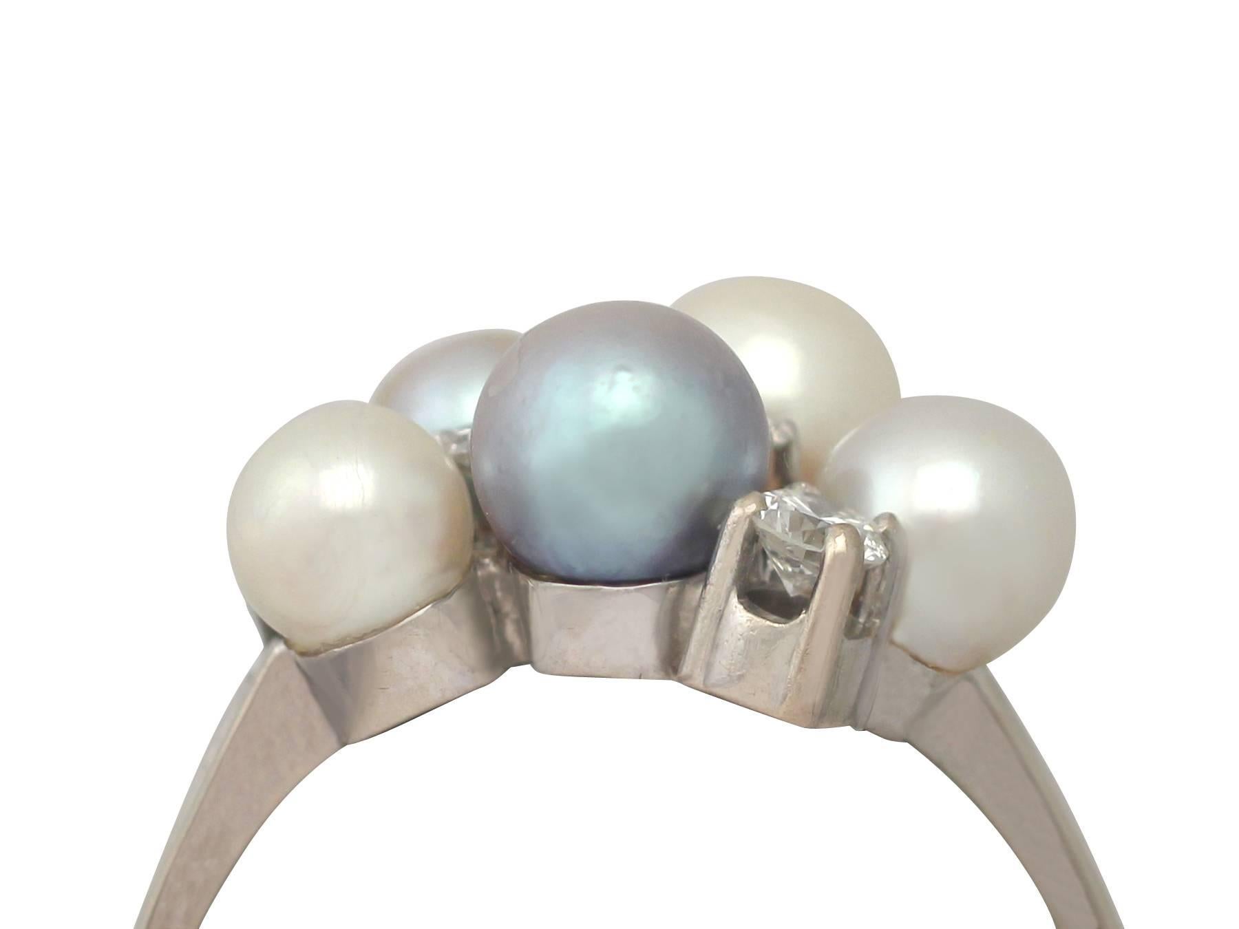 A fine and impressive vintage cultured pearl and 0.55 carat diamond, 14 carat white gold dress ring; part of our diverse vintage jewellery collections.

This fine and impressive vintage cultured pearl ring has been crafted in 14 ct white gold.

The