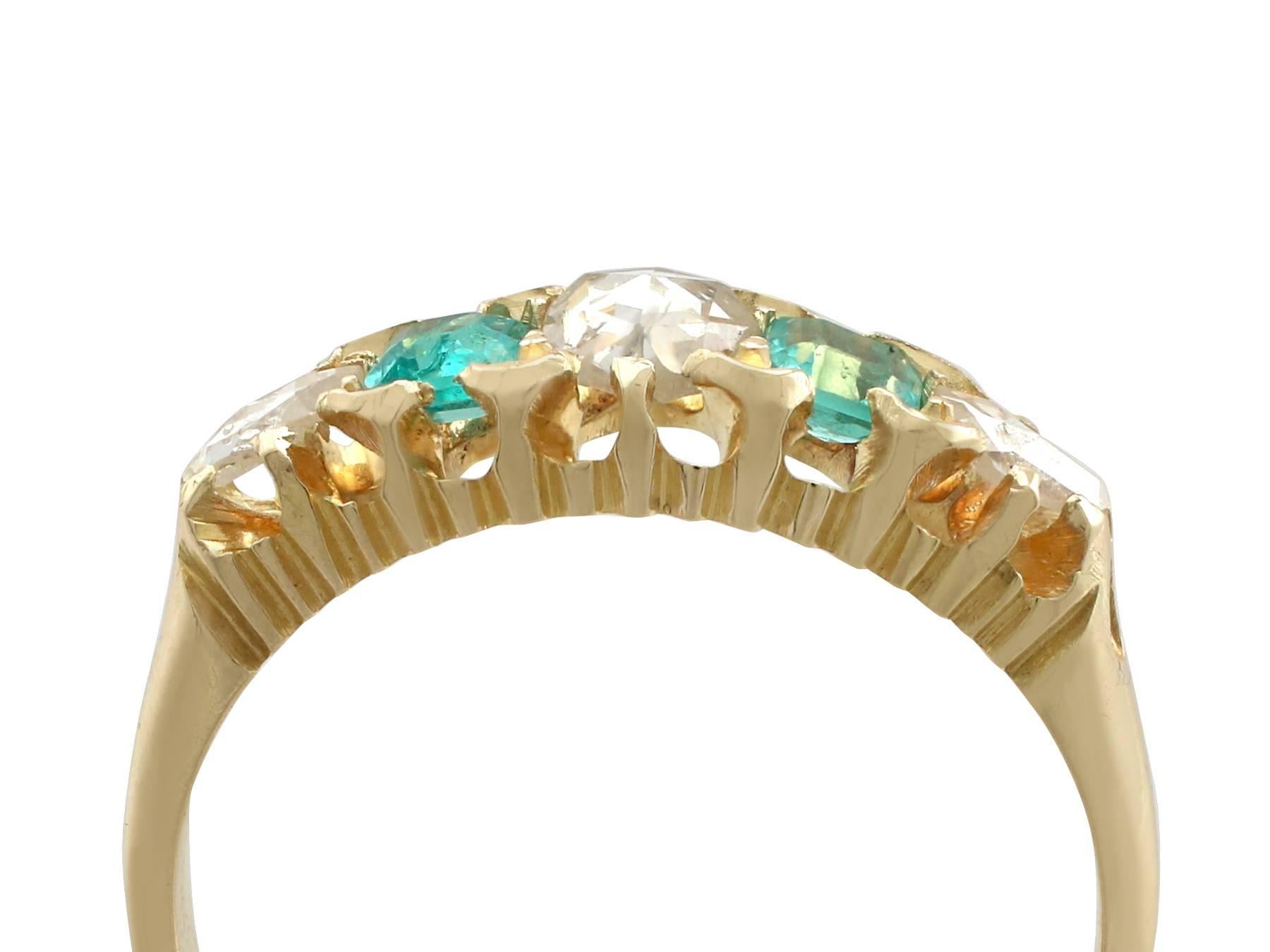 An impressive Victorian 0.55 carat diamond and 0.42 carat emerald, 18 carat yellow gold five stone cocktail ring; part of our diverse antique jewellery collections.

This fine and impressive Victorian emerald and diamond ring has been crafted in 18