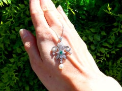 0.23 Carat Emerald 0.75 Carat Diamond Pearl and Platinum Pendant Circa 1935