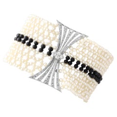 Antique Pearl 4.00 Carat Onyx 2.42 Carat Diamond Platinum Bracelet Circa 1925