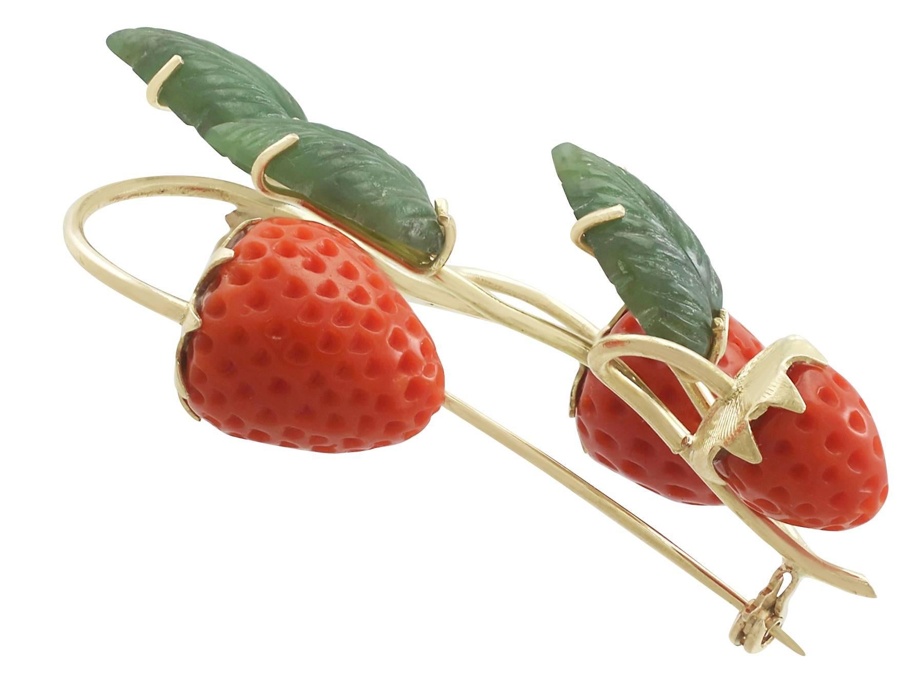 An impressive vintage nephrite jade and red coral, 18 carat yellow gold 'strawberry' brooch; part of our diverse gemstone jewellery and estate jewelry collections.

This fine and impressive vintage strawberry brooch has been crafted in 18 ct yellow
