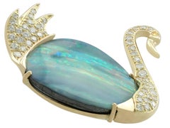 1980s 13.79 Carat Opal 1.15 Carat Diamond 18 Karat Yellow Gold 'Swan' Brooch