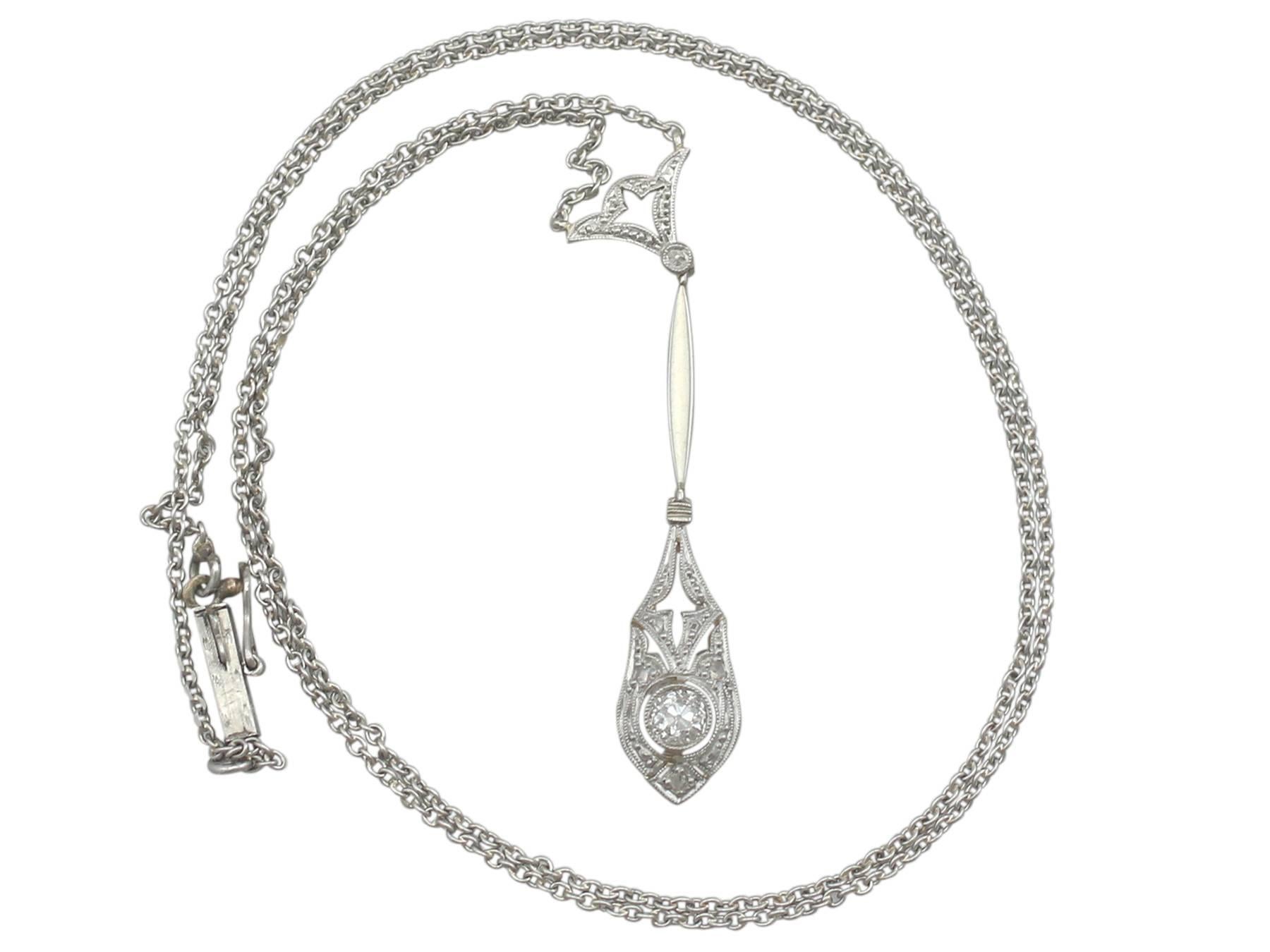 A fine and impressive 0.19 carat diamond and 14k yellow gold, 14kwhite gold set necklace with platinum chain; part of our diverse antique jewellery collections.

This fine and impressive antique diamond drop necklace has been crafted in 14k yellow