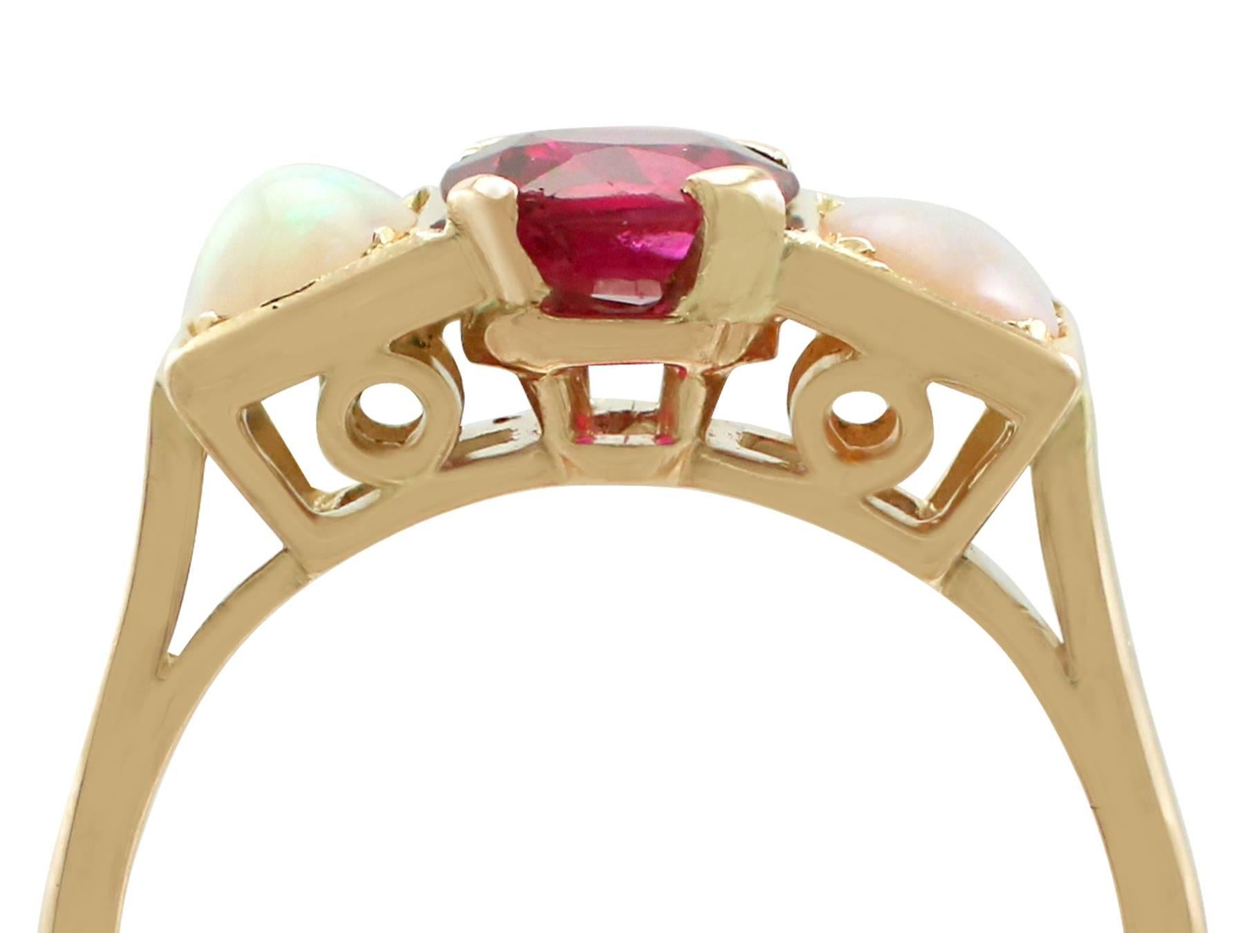 An impressive vintage French 1.86 carat ruby and 0.80 carat opal, 18 karat yellow gold dress ring; part of our diverse gemstone jewellery collections.

This fine and impressive vintage opal and ruby ring has been crafted in 18k yellow gold.

The