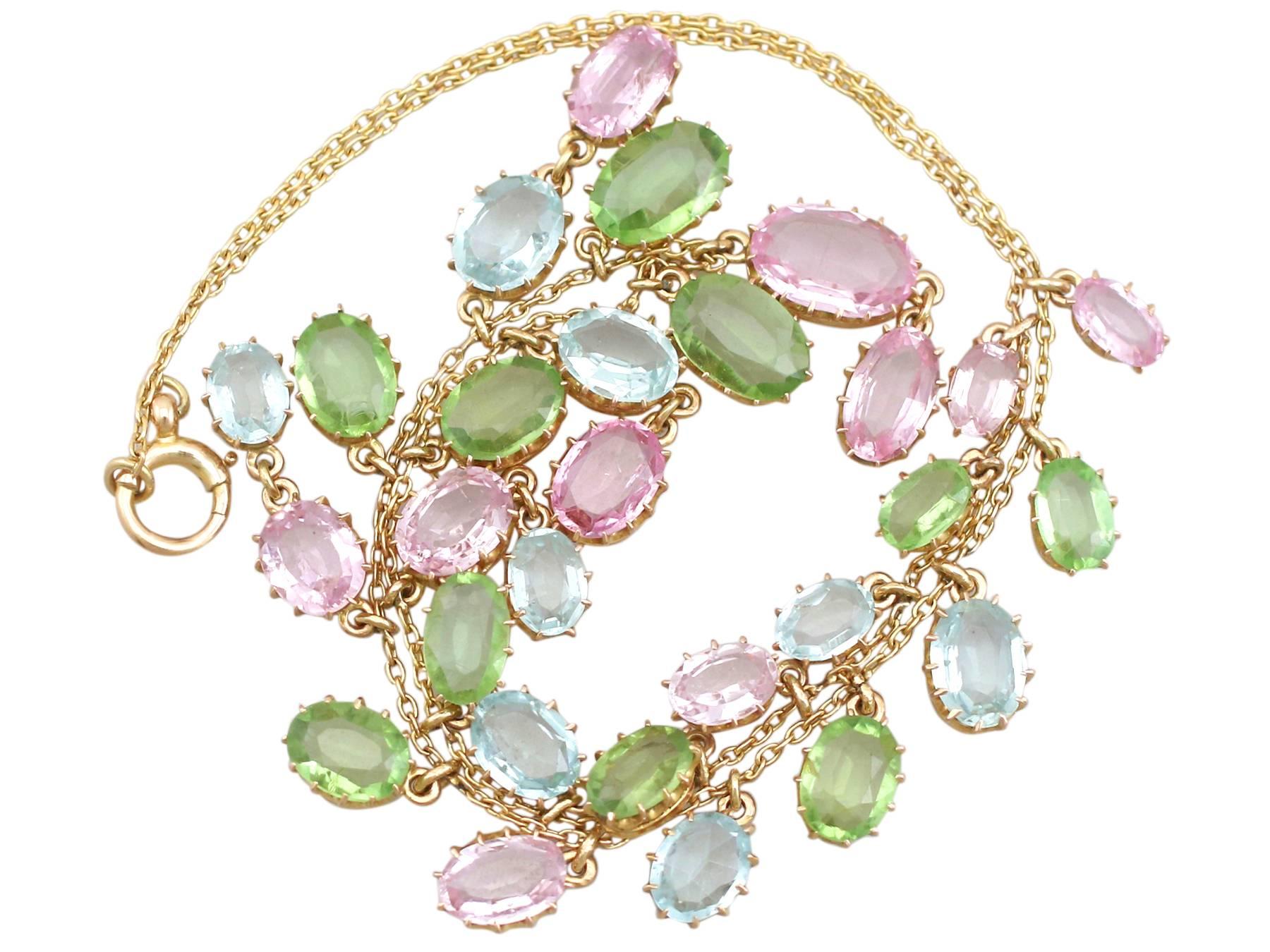 A stunning antique 25.87 carat (total) rose quartz, peridot and aquamarine, 18 ct and 10 ct yellow gold necklace; part of our diverse antique jewellery collections.

This stunning, fine and impressive antique multi gem necklace has been crafted in