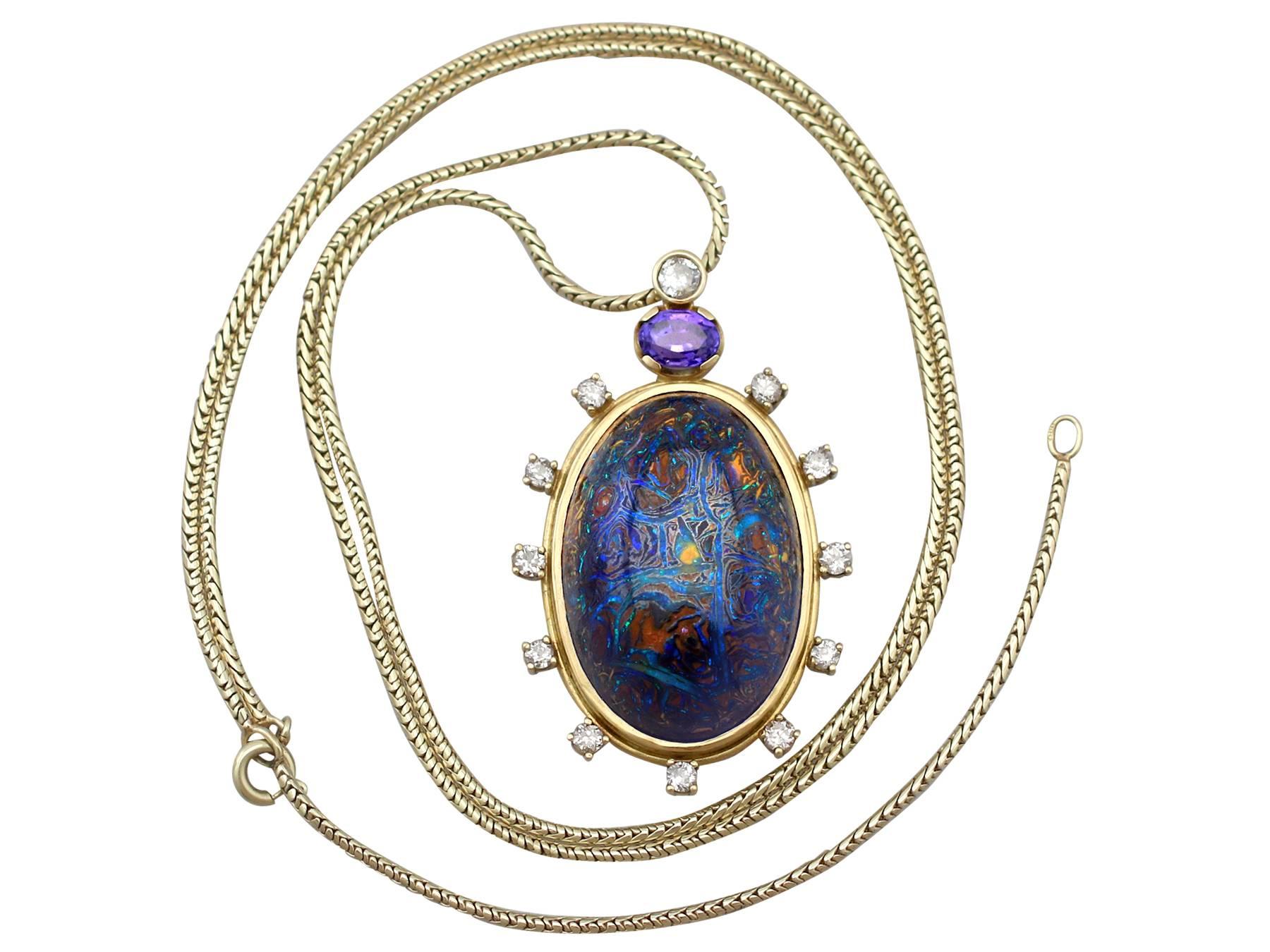 This exceptional and stunning boulder opal pendant has been crafted in 18k yellow gold.

The German-made pendant has an oval form displaying a stunning central cabochon cut boulder opal encircled by a stepped plain 18k yellow gold frame.

The