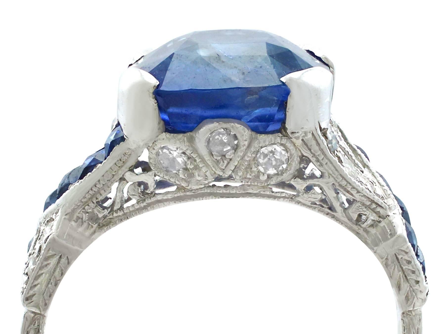 A stunning and fine antique 4.84 Ct natural blue sapphire and 0.18 Ct diamond, platinum dress ring; part of our antique jewelry and estate jewelry collections.

This impressive and stunning antique blue sapphire ring has been crafted in