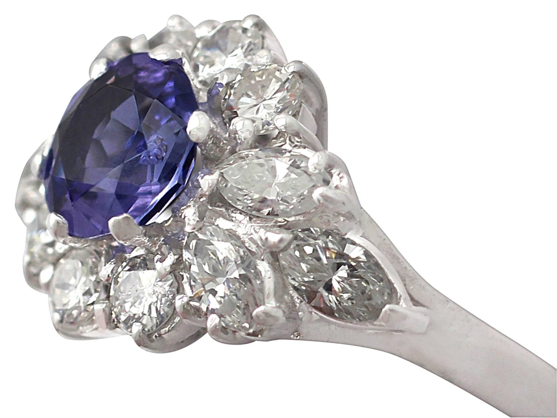 A stunning, fine and impressive vintage 1.65 carat diamond and 1.15 carat natural blue sapphire cluster ring in 18 karat white gold; part our vintage jewelry and estate jewelry collections

This stunning vintage sapphire cluster ring has been