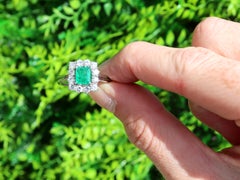 Emerald Cut Emerald and Diamond White Gold Cluster Ring
