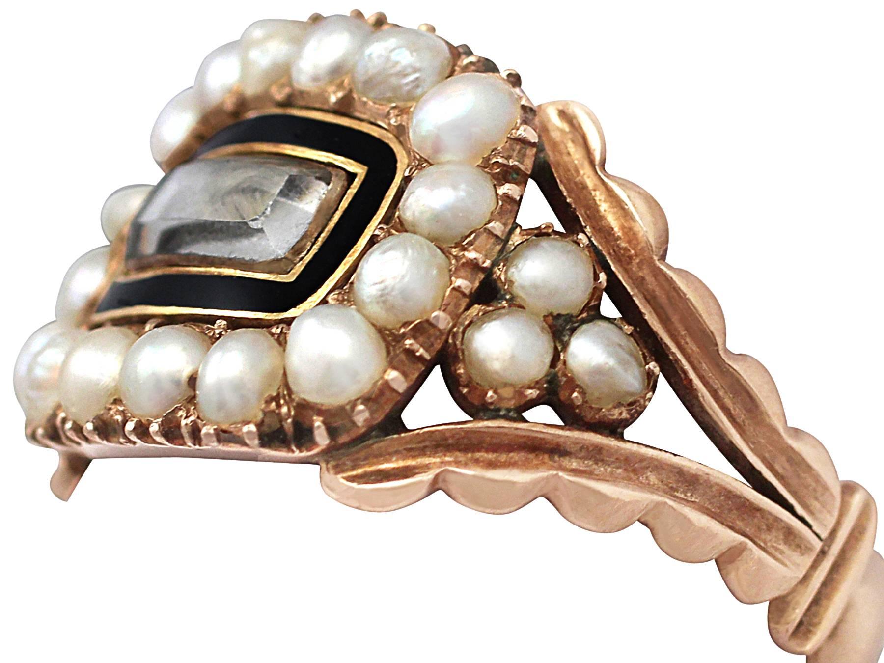 A fine and impressive antique Victorian pearl and enamel, 9 karat yellow gold mourning ring; part of our antique jewelry and estate jewelry collections

This fine Victorian pearl ring has been crafted in 9k yellow gold.

The low profile frame