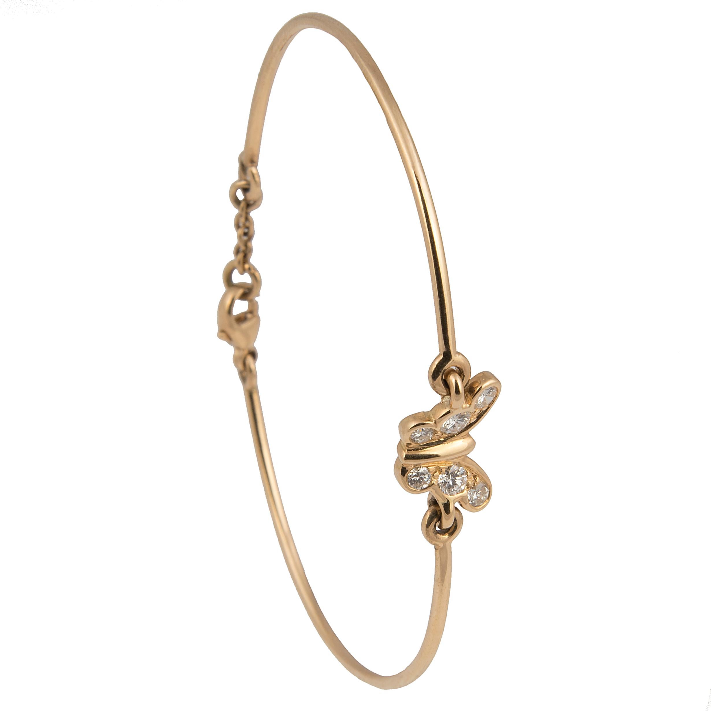 Bracelet designed by Florence Larochas, 

Elegant bracelet designed by Florence Larochas, the articulated 18kt yellow gold wire centred by a butterfly, set with six brilliant cut F/G colour diamonds.
Lenght 16,3 cm