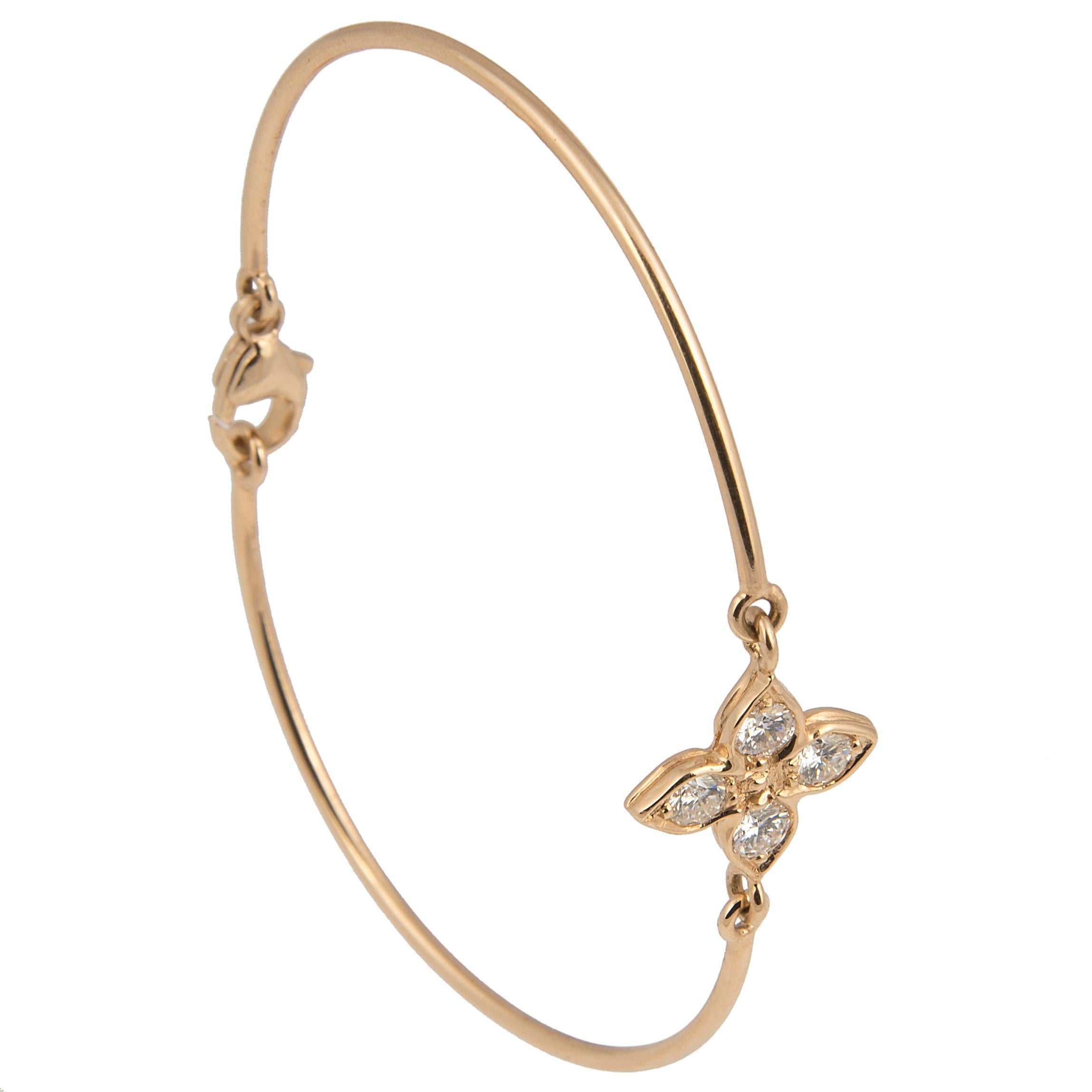 Elegant bracelet designed by Florence Larochas, the articulated 18kt yellow gold wire centred by a shower shaped motif, each petal set with a brilliant cut F/G color diamond.

