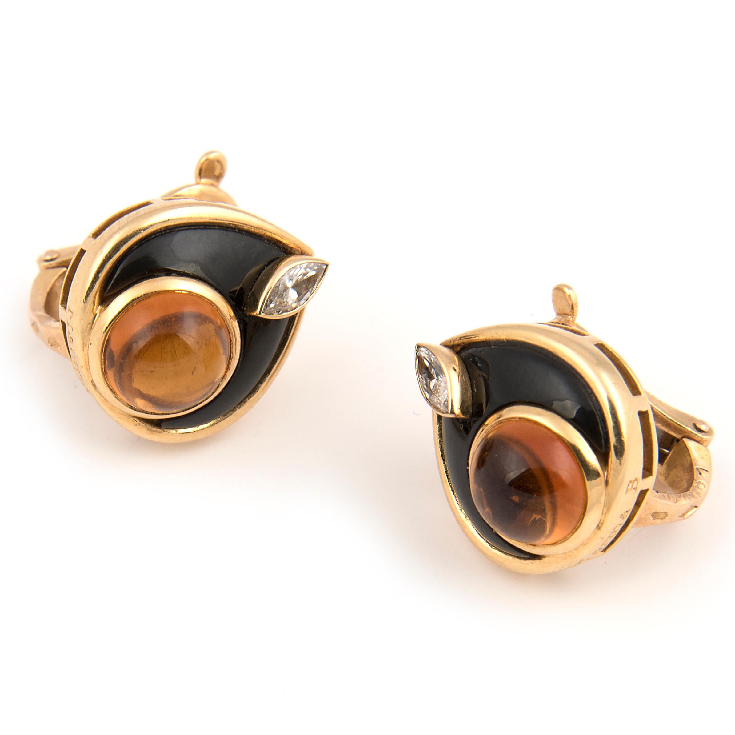Pair of clip-on stud earrings by Marina B (Bulgari), 18kt Yellow gold with a cabochon citrine and a marquise diamond surrounded with onyx.
Signed Marina B, maker's mark, French hallmarks and numbered.
Circa 1980

Marina Bulgari is from the third