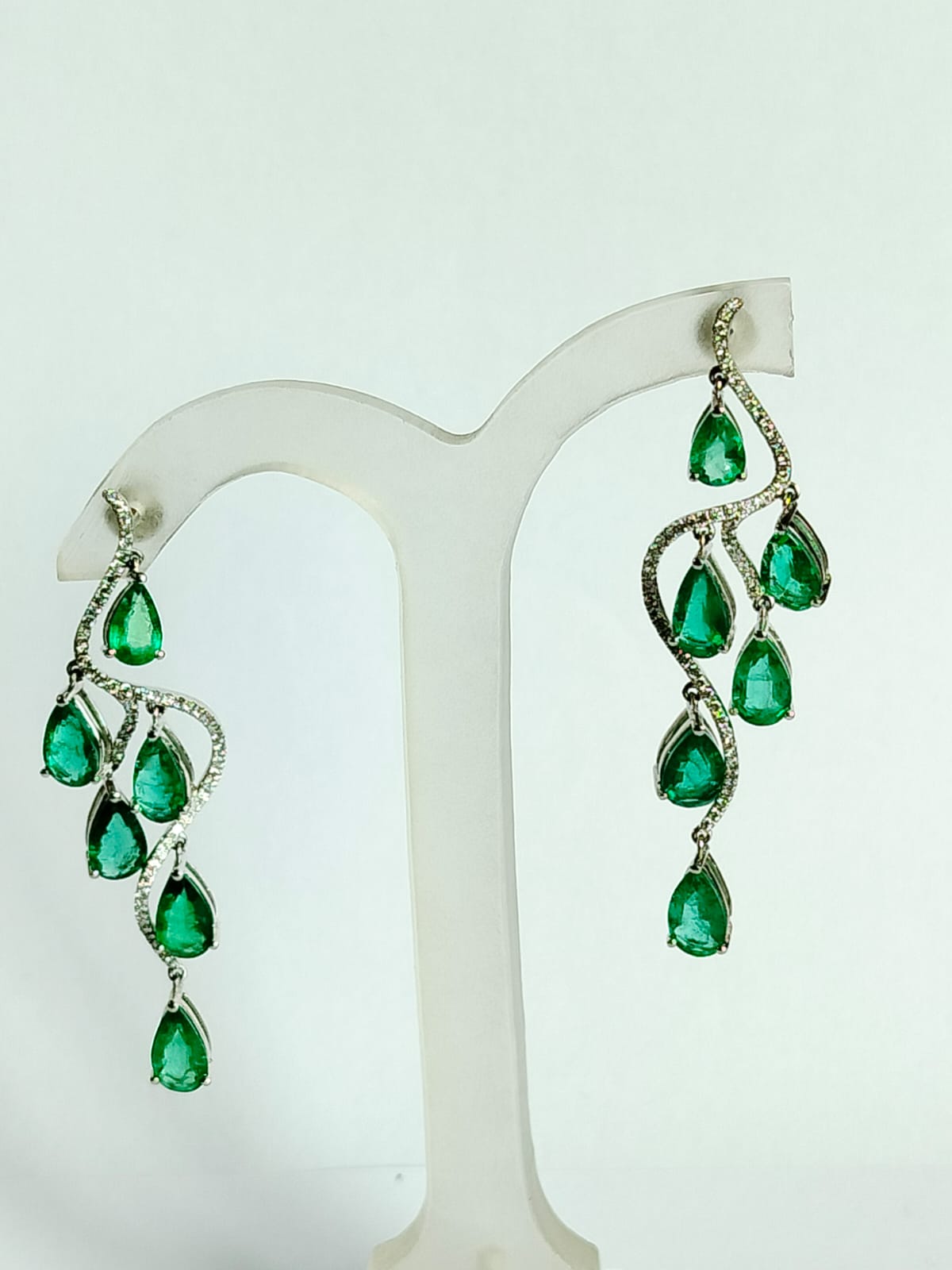 A very gorgeous and beautiful, Emerald Chandelier Earrings / Shoulder Dusters set in 18K White Gold. The weight of the pear shaped Emeralds is 7.81 carats. The Emeralds are completely natural, without any treatment and is of Zambian origin. The
