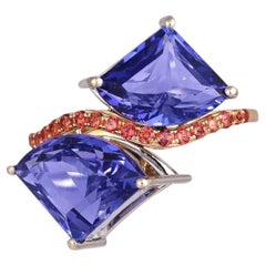 Anello di fidanzamento “Toi et Moi” con tanzanite e zaffiro arancione, incastonato in oro bianco 18 carati