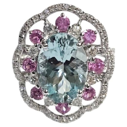 Anillo de compromiso tipo cóctel con aguamarina, zafiro rosa y diamantes, engastado en oro de 18 quilates