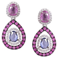 Set in 18K white Gold, Blue Sapphire, Pink Sapphire & Diamond Dangle Earrings