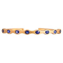 Set in 18K Yellow Matte Gold, Ceylon Blue Sapphire modern Bangle Bracelet