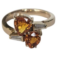 Set in 18K Gold, Orange Sapphire & Tapered Baguette Diamond Engagement Ring