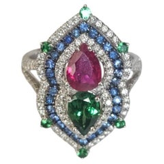 Set in 18K Gold, Ruby, Tsavorite Garnet, Blue Sapphire & Diamond Engagement Ring
