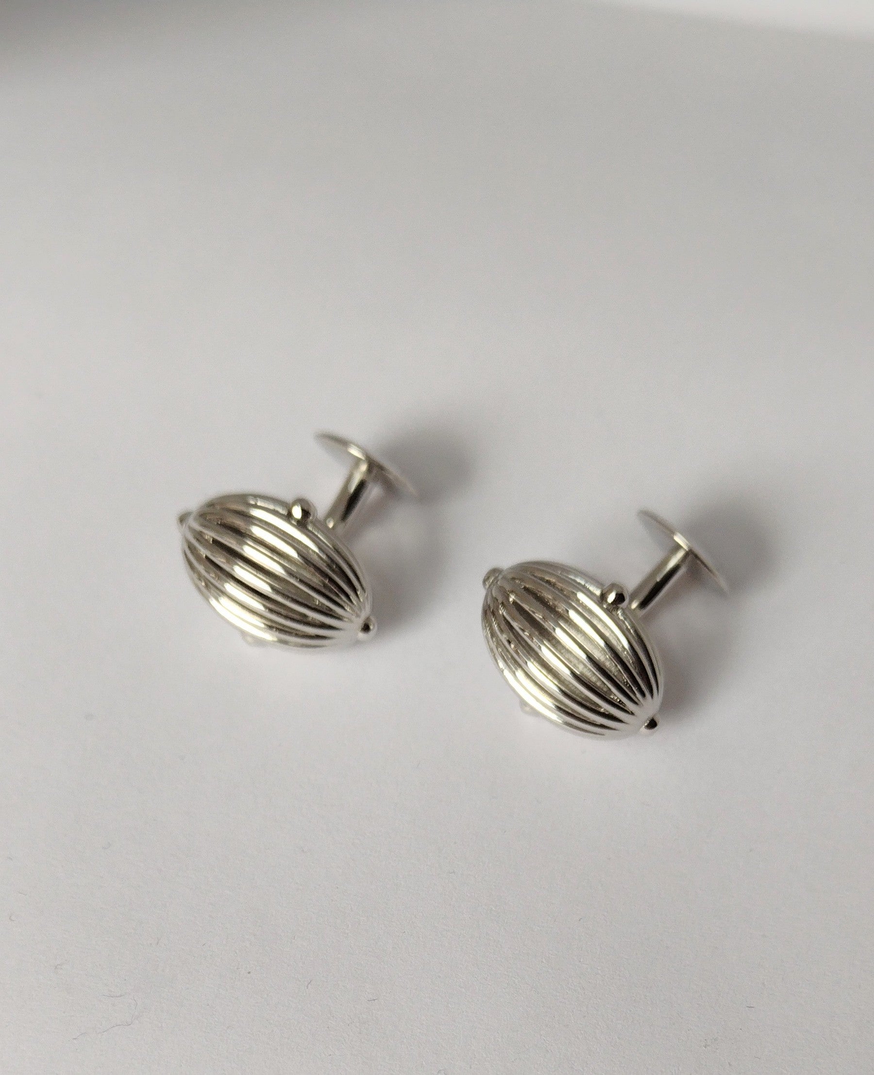 Platinum Oval Wire Sphere Yellow  Cufflinks,  This design came from my early sculptures where I made hollow forms that create moire patterns. The elements of air and light inspire all my pieces. This originally was designed as an andiron for the