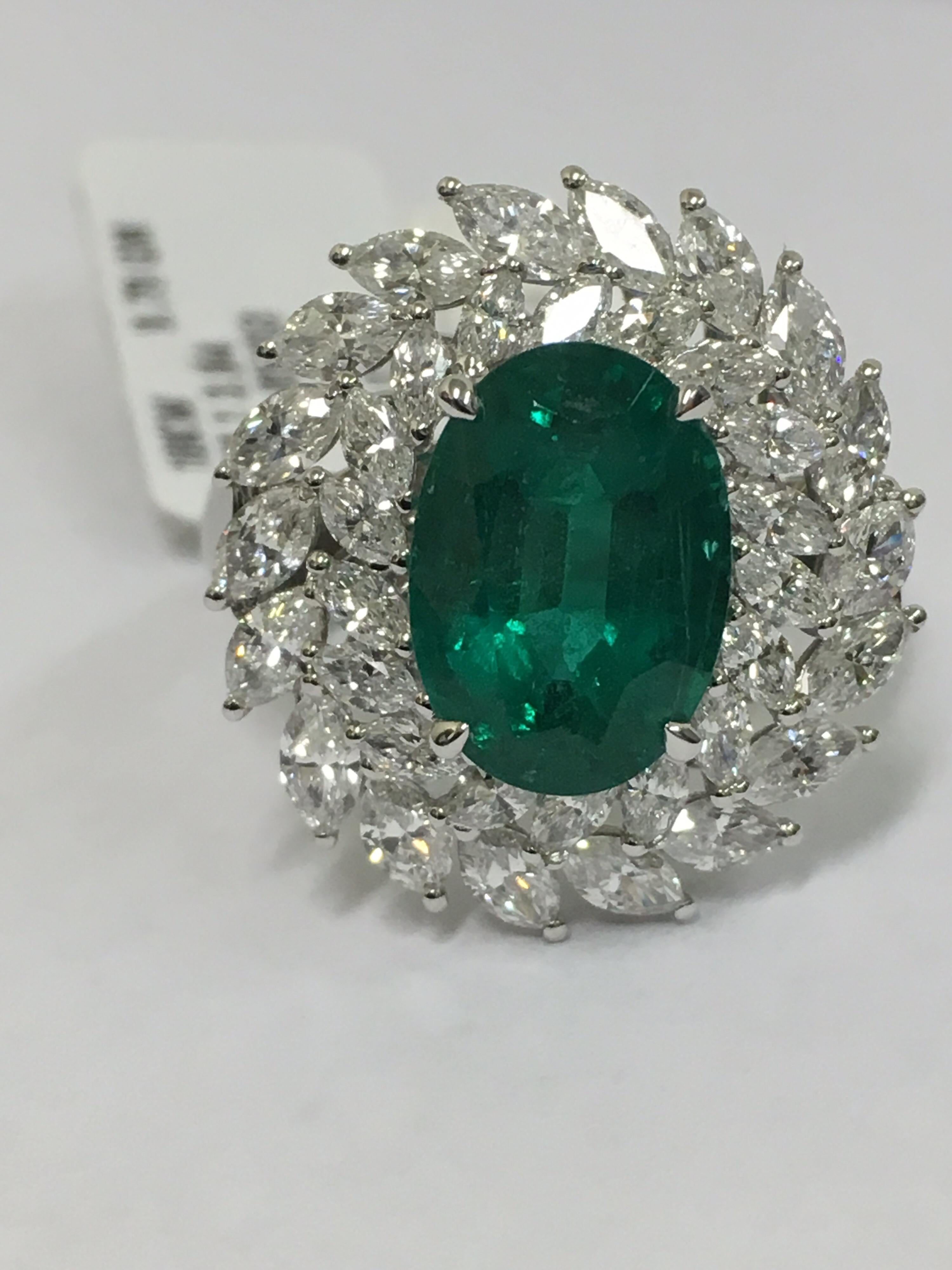 Natural Colombian Emerald weight 3.84 Carat.
Marquise shape 18 piece which weigh 1.57 Carat (Bigger Marquise)
Marquise Shape 18 Piece which is 0.68 Carat (Smaller Marquise)
The Ring is set in 18 Karat White Gold.
Total Gold is 9.79 Gram.
The ring is