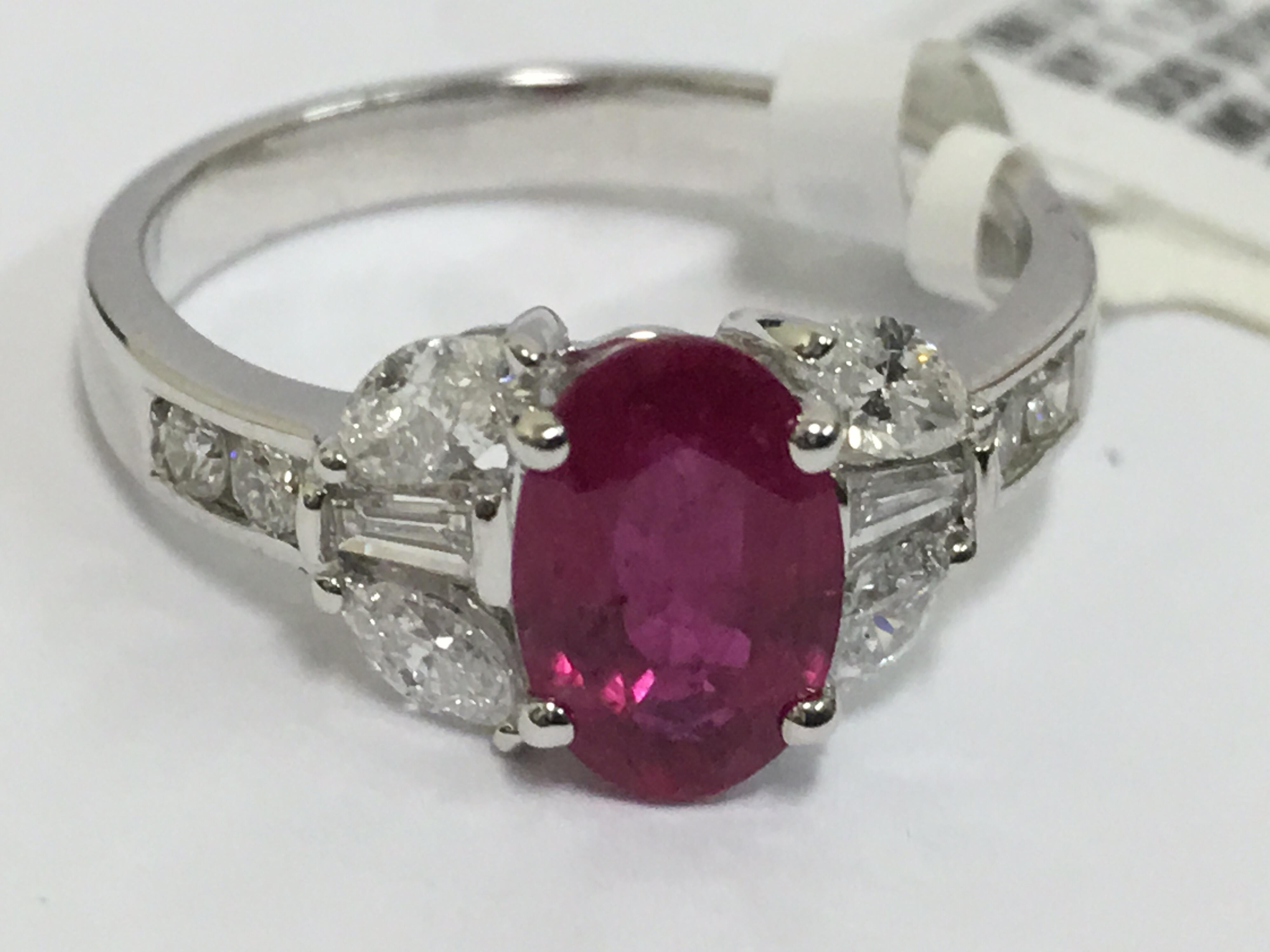 Oval Cut Ruby and Diamond Ring