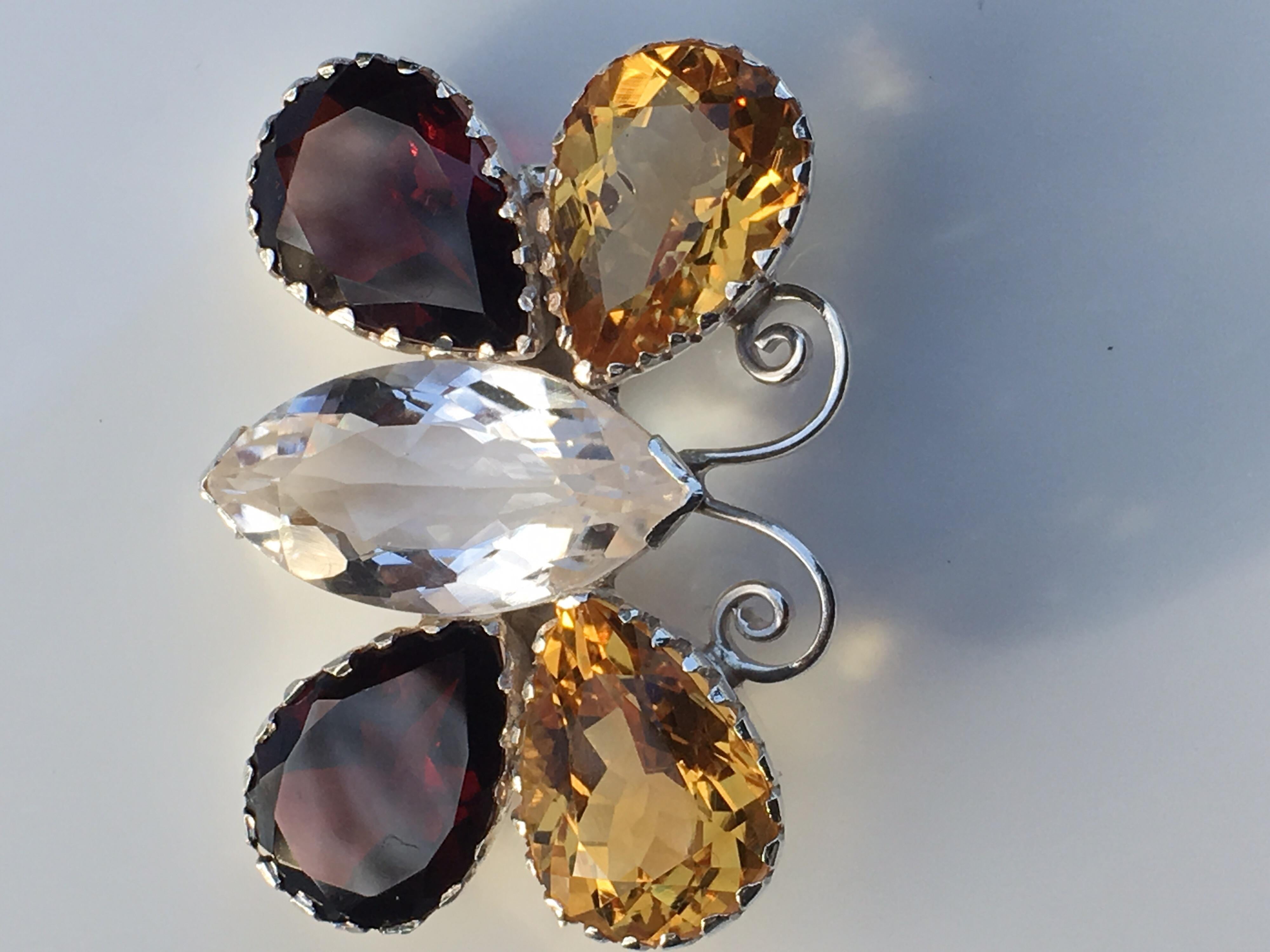 Natural Rock Crystal Red Garnet and Citrine set in sterling silver Hand crafted one of a kind Brooch Pin. The Pin is 12.05 Gram. Approx 28 Carat stones.Size of the Tears Drop is 10 MM X 14 MM and Rock Crystal is 10 MM X 20 MM