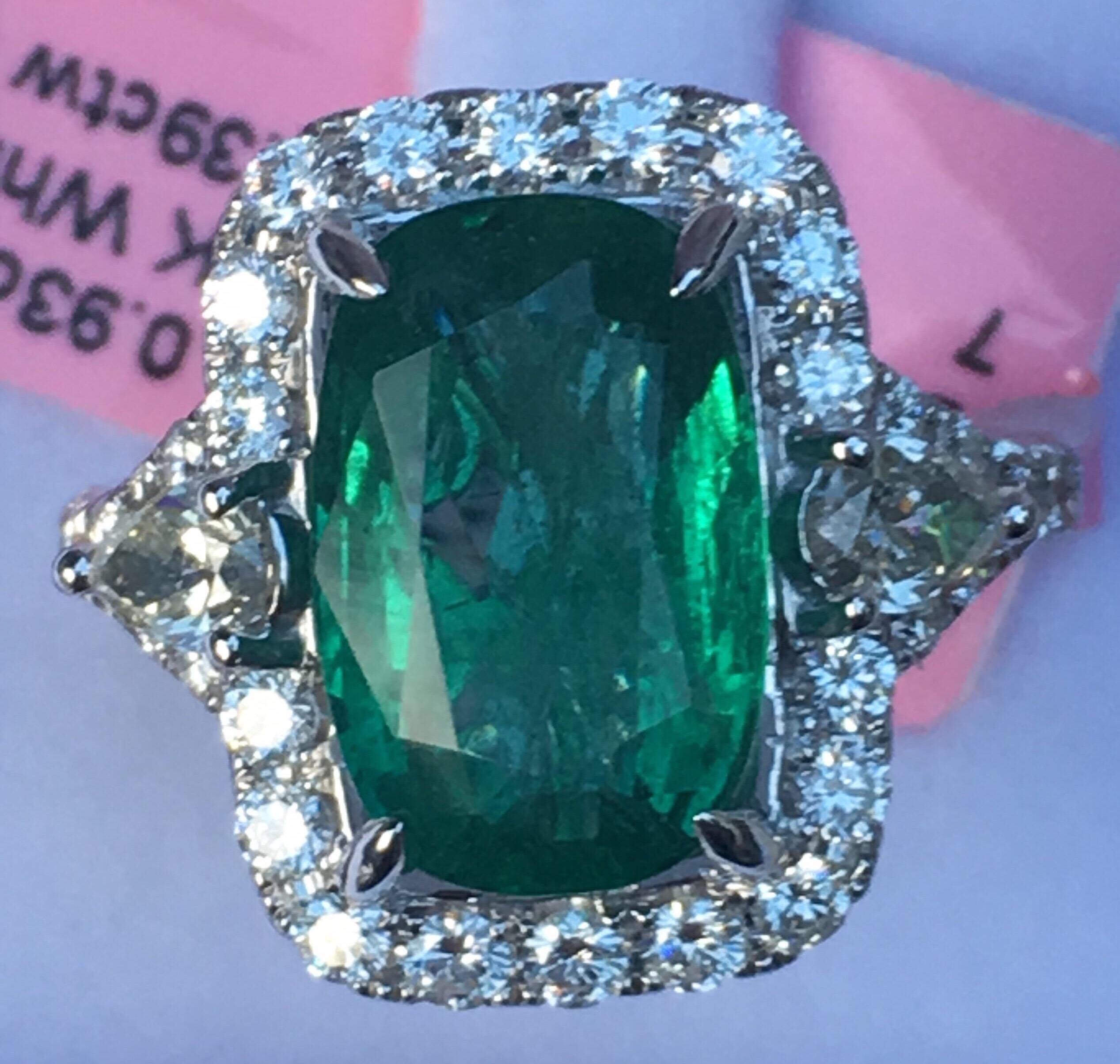 Natural Emerald and Diamonds Set in 18K White Gold. The Emerald is 4.42 Carat and Total Weight of Diamond is 1.32 Carat. The Ring is hand crafted one of a kind .Size of the Ring is 7 but can be resized.