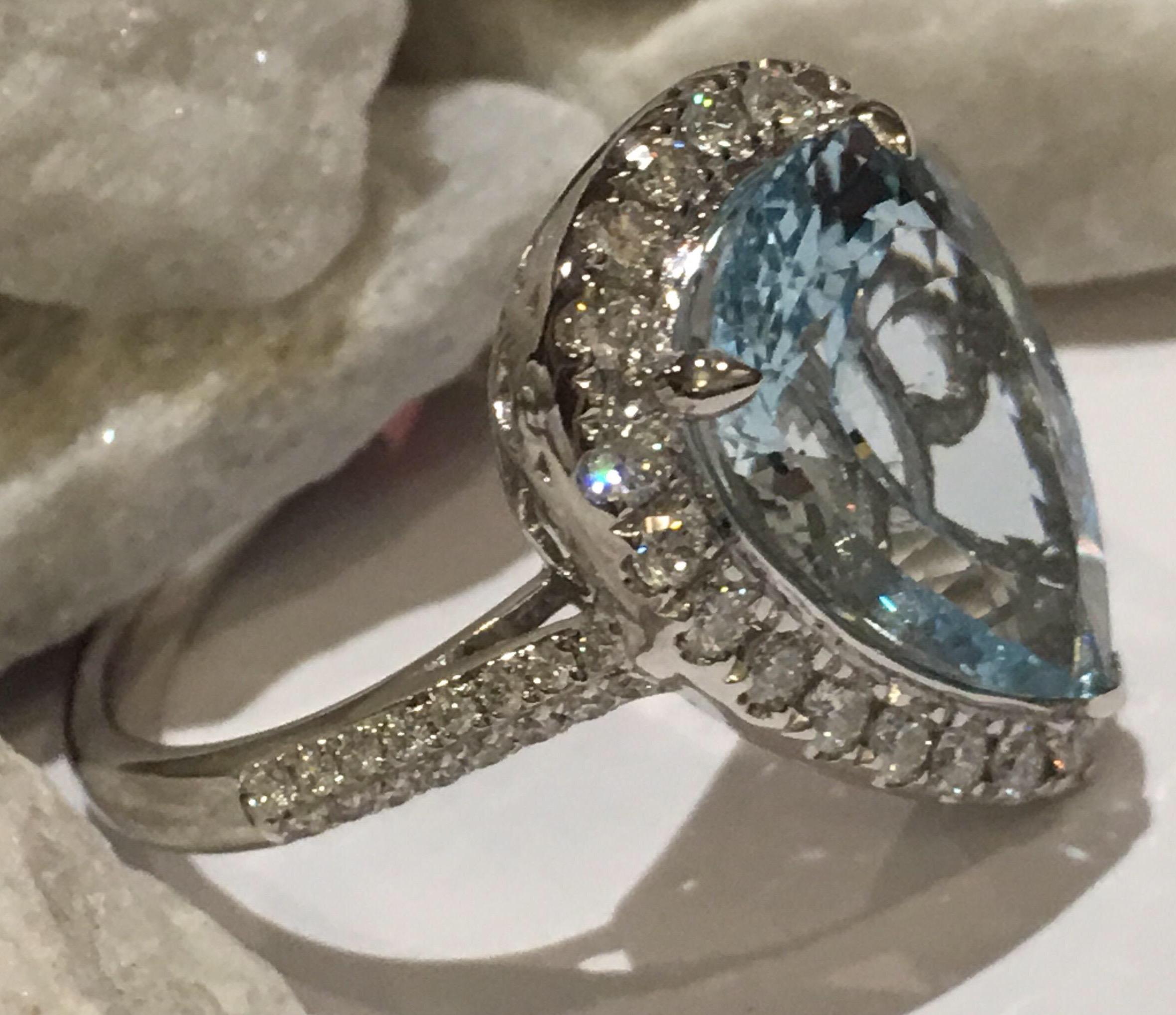 Natural Aquamarine set in 14K white gold. Pear shape 3.81 Carat Aquamarine is with 0.55 Carat Diamonds.
One of a kind handcrafted ring is elegant.
The size of the ring is 7 and this ring can be resized.